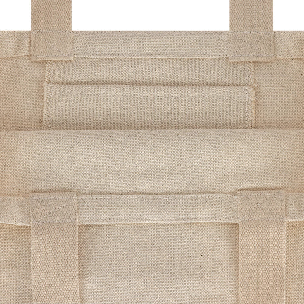 New Era Graphic Light Beige Tote Bag, detailed front view featuring overlapping light beige fabric panels with stitching, broad and shoulder straps for carrying, and a seamless design highlighting the bag's simple yet functional aesthetic.