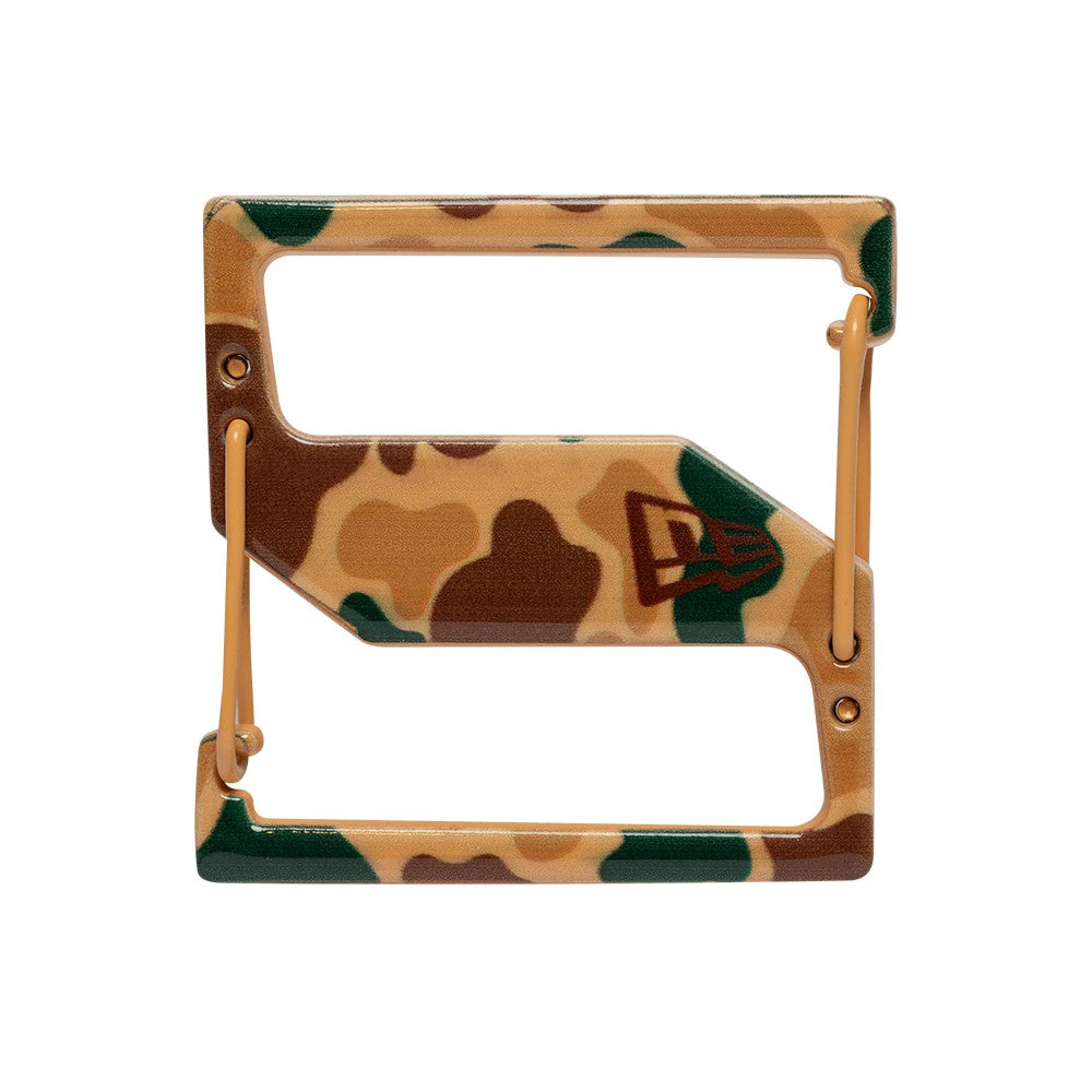 New Era Duck Camo Cap Clip, front view showing the rectangular shape with a beige, brown, and green camouflage pattern, featuring the New Era flag logo on the right side and tan plastic fasteners at each end.