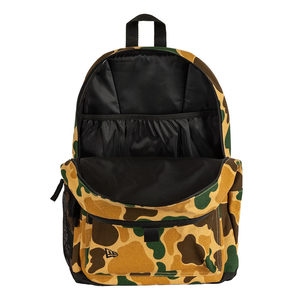 New Era Camo Light Beige Delaware Backpack, open view highlighting the spacious main compartment with a black interior and elastic pockets inside, camo pattern in light beige, green, and brown on the exterior.