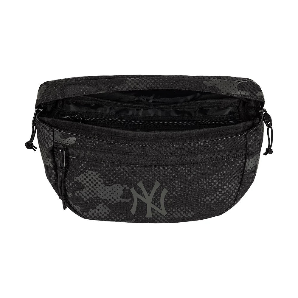 New Era New York Yankees MLB Camo Black Waist Bag, open view showing the spacious main compartment with a zip closure, black and grey camo pattern across the fabric, and a printed Yankees logo on the front centre of the bag.