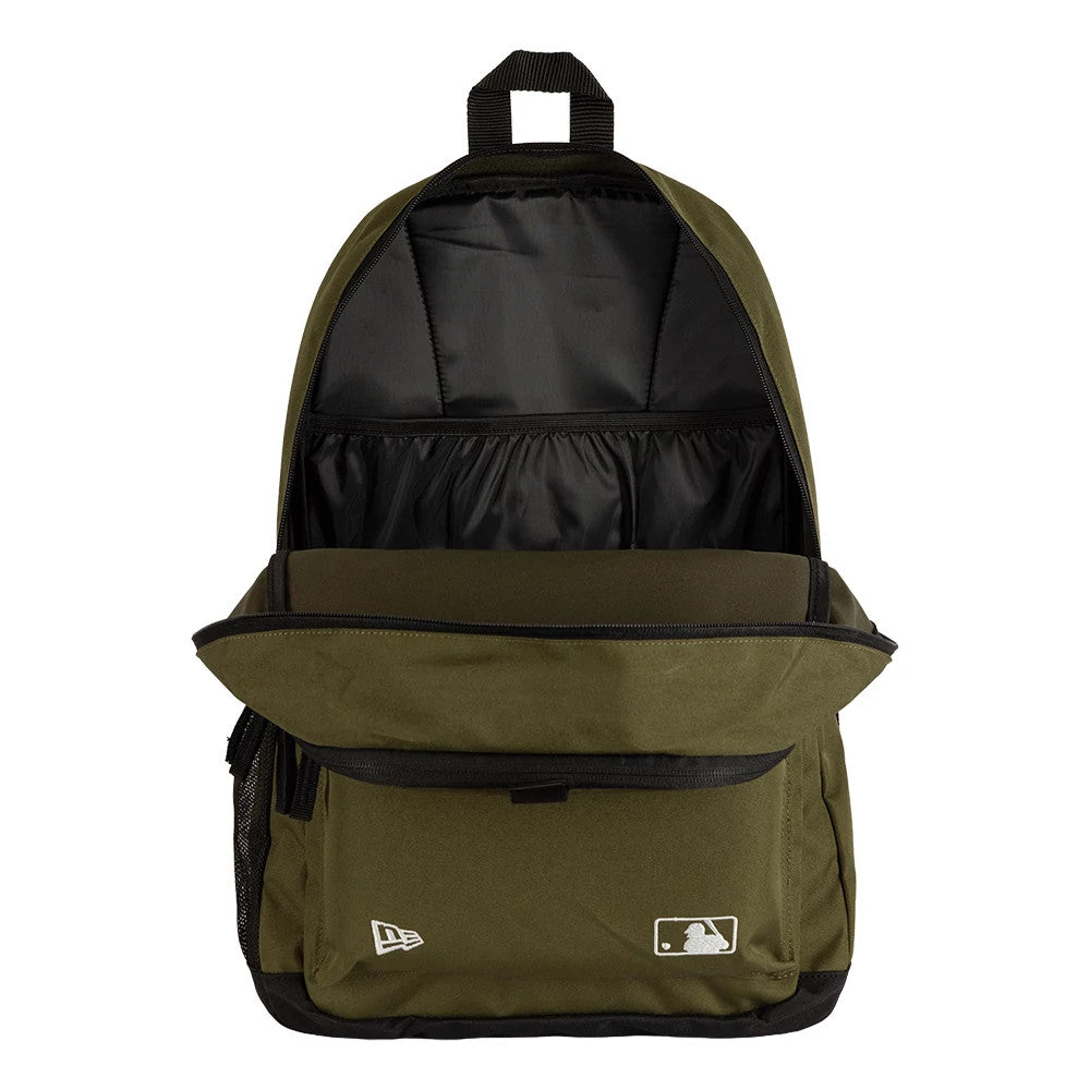 New Era New York Yankees MLB Dark Green Delaware Backpack, open view displaying the interior with a large, spacious compartment, dark green exterior, and front pouch featuring an embroidered New Era logo.