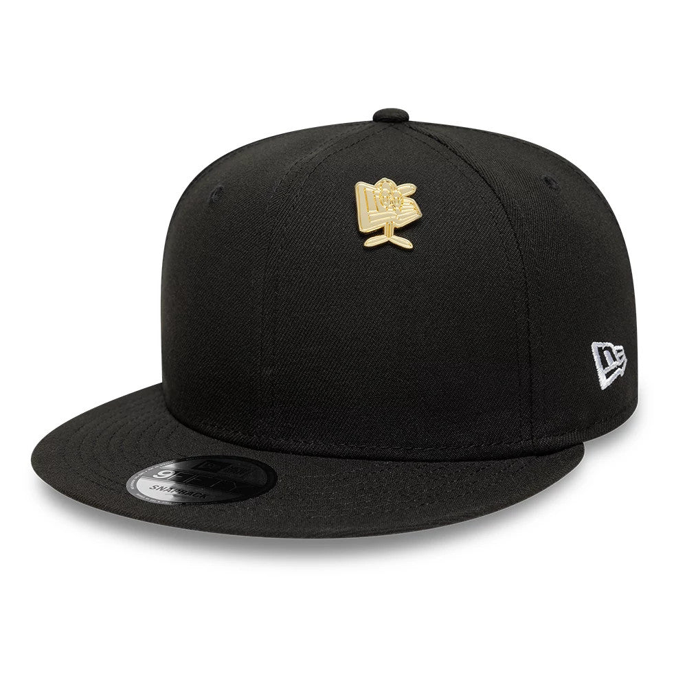 Pictured is this New Era Flag Character Pin Badge in gold. 2