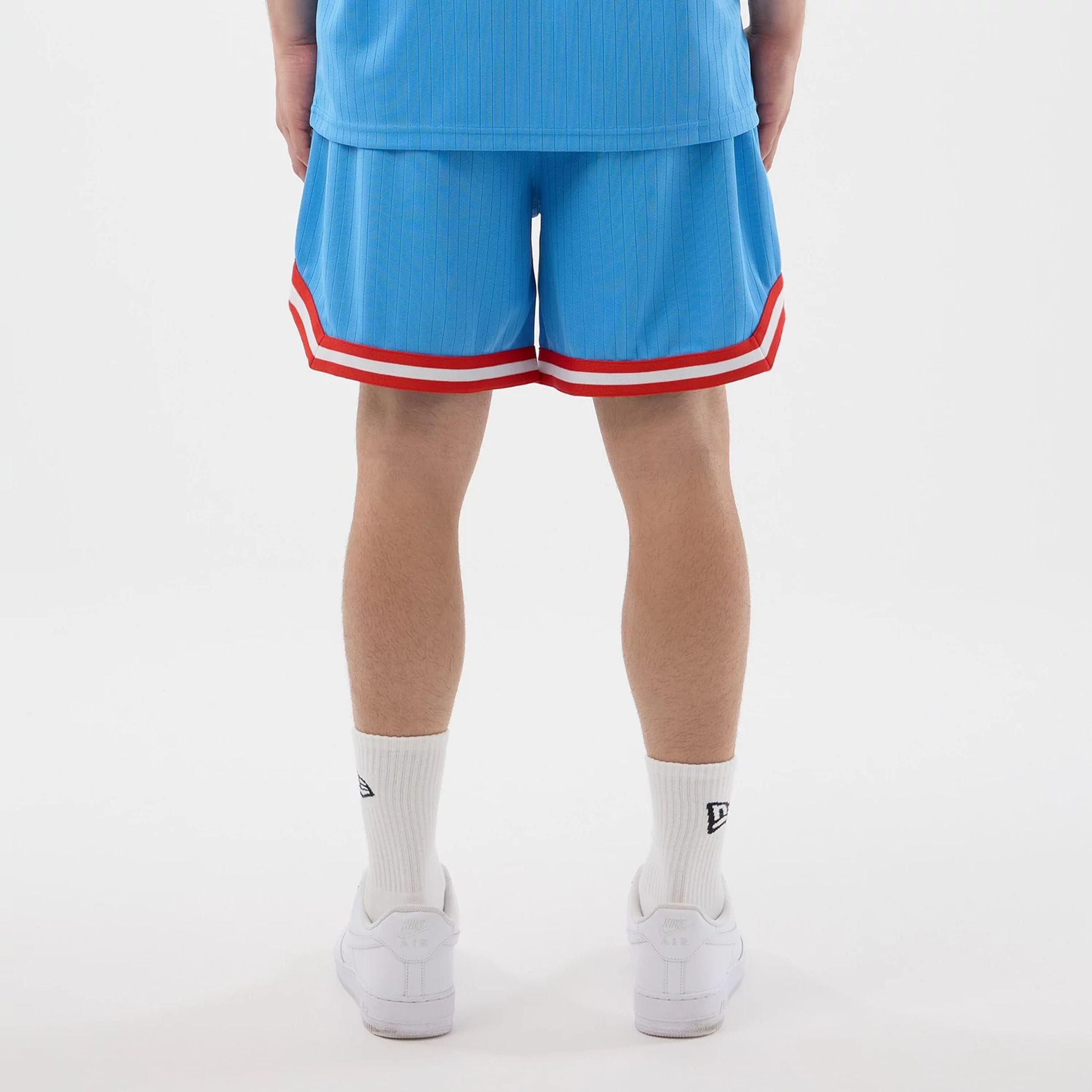 The model is wearing this MLB Arch New York Yankees Oversized Shorts in pastel blue. 2