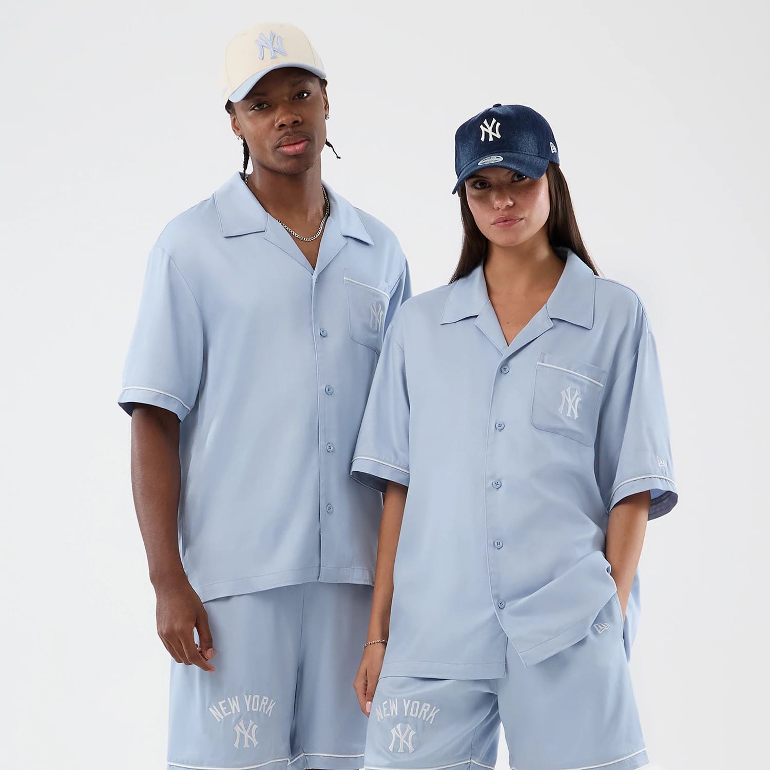 The model is wearing this MLB Graphic Revere New York Yankees Short Sleeve Shirt in pastel blue. 1