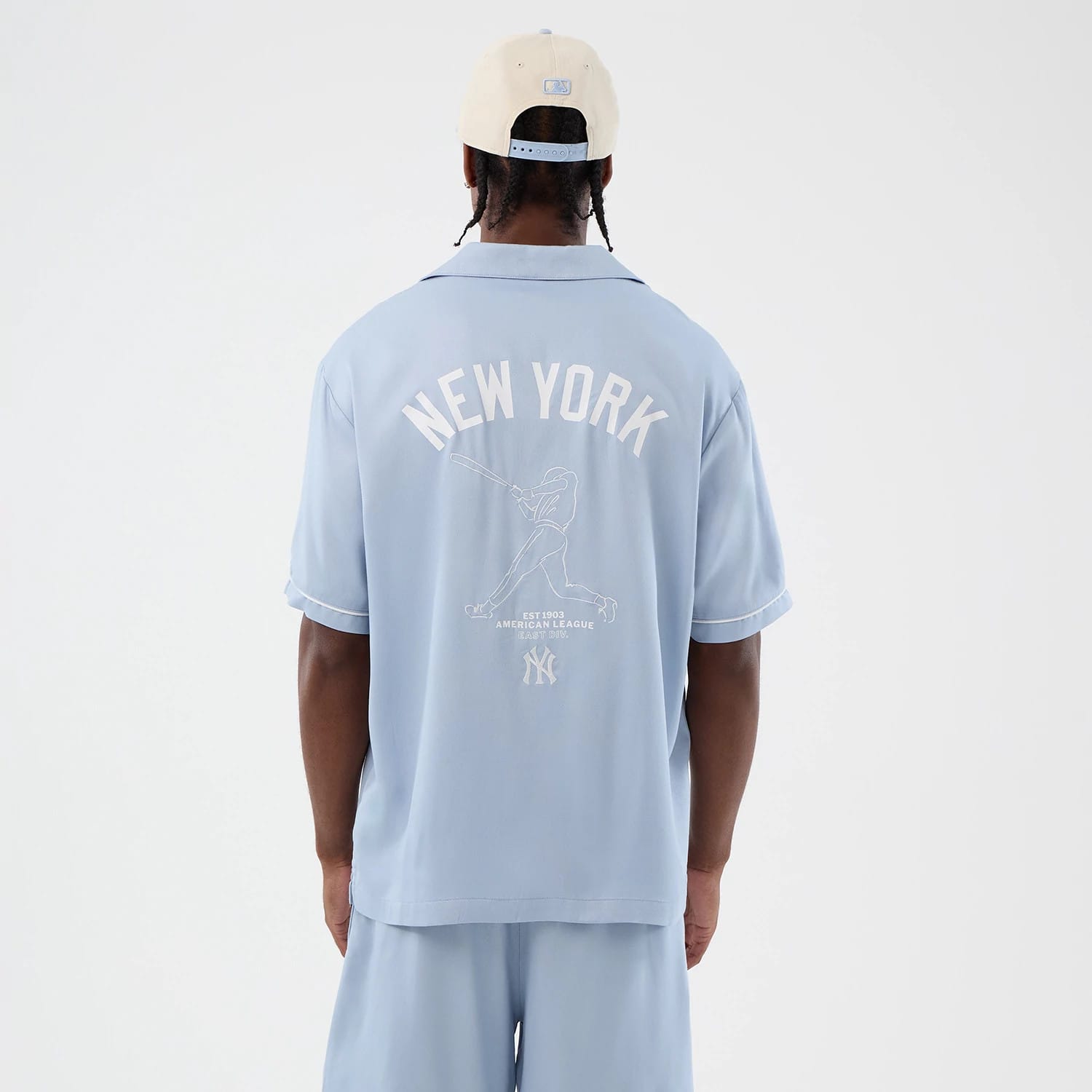 The model is wearing this MLB Graphic Revere New York Yankees Short Sleeve Shirt in pastel blue. 2