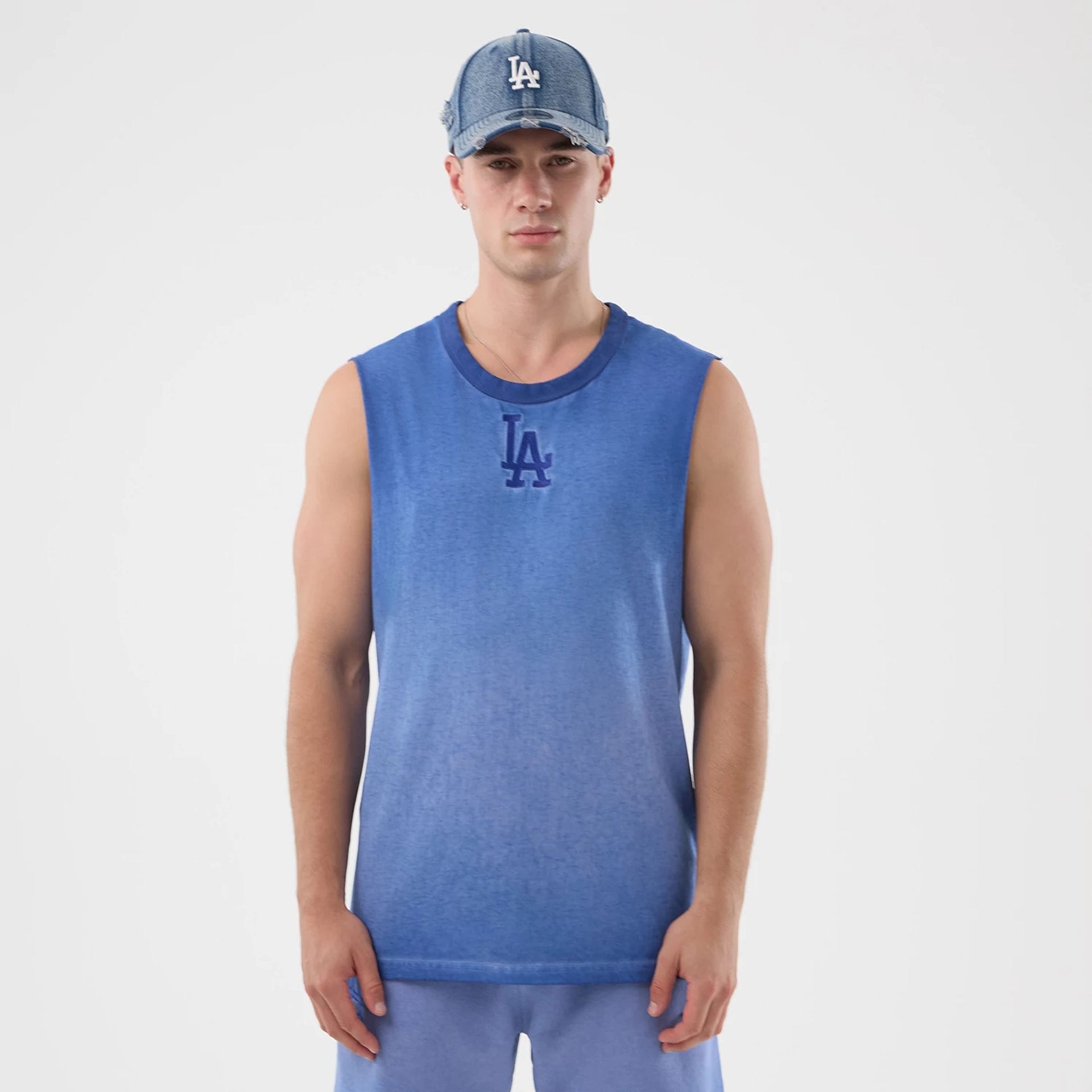 The model is wearing this MLB Washed Logo LA Dodgers Vest in pastel blue. 1