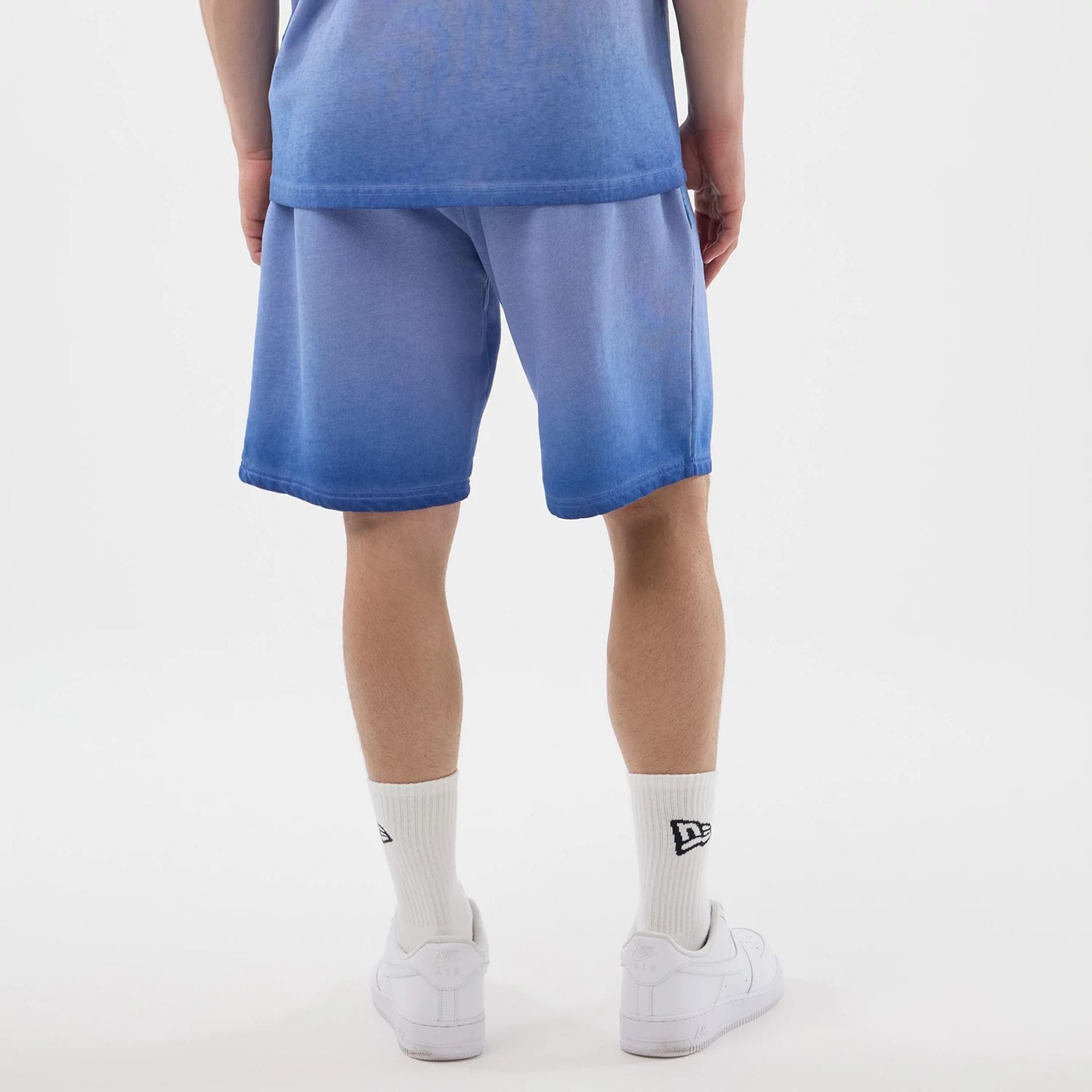 The model is wearing this MLB Washed Logo LA Dodgers Shorts in pastel blue. 2