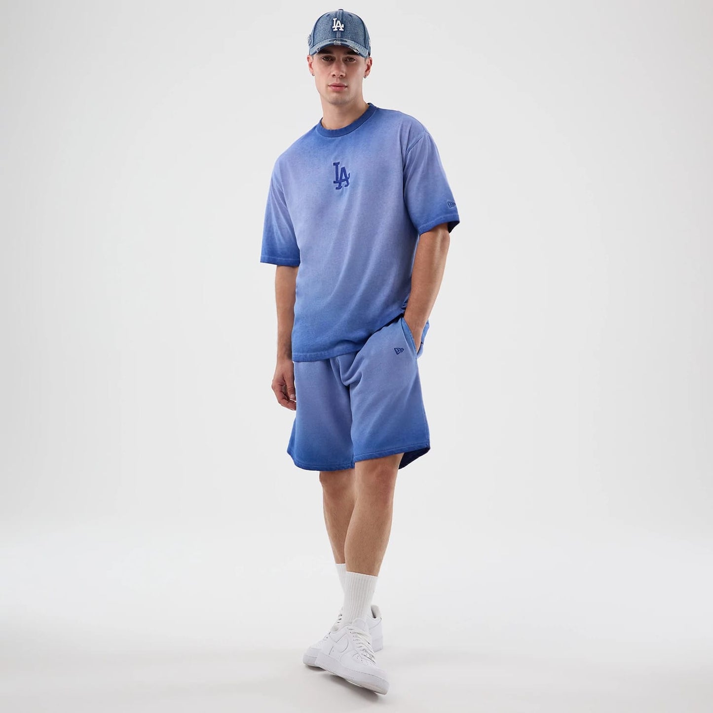 The model is wearing this MLB Washed Logo LA Dodgers Shorts in pastel blue. 8