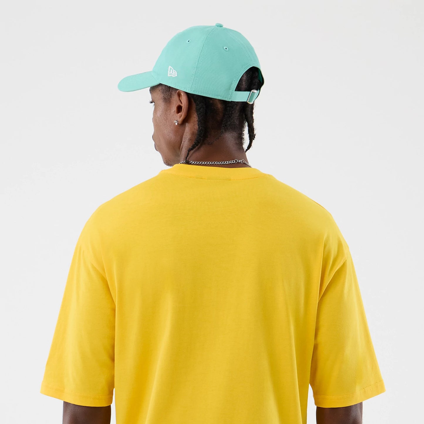 The model is wearing this New Era Alligator Character Graphic T-Shirt in yellow. 8