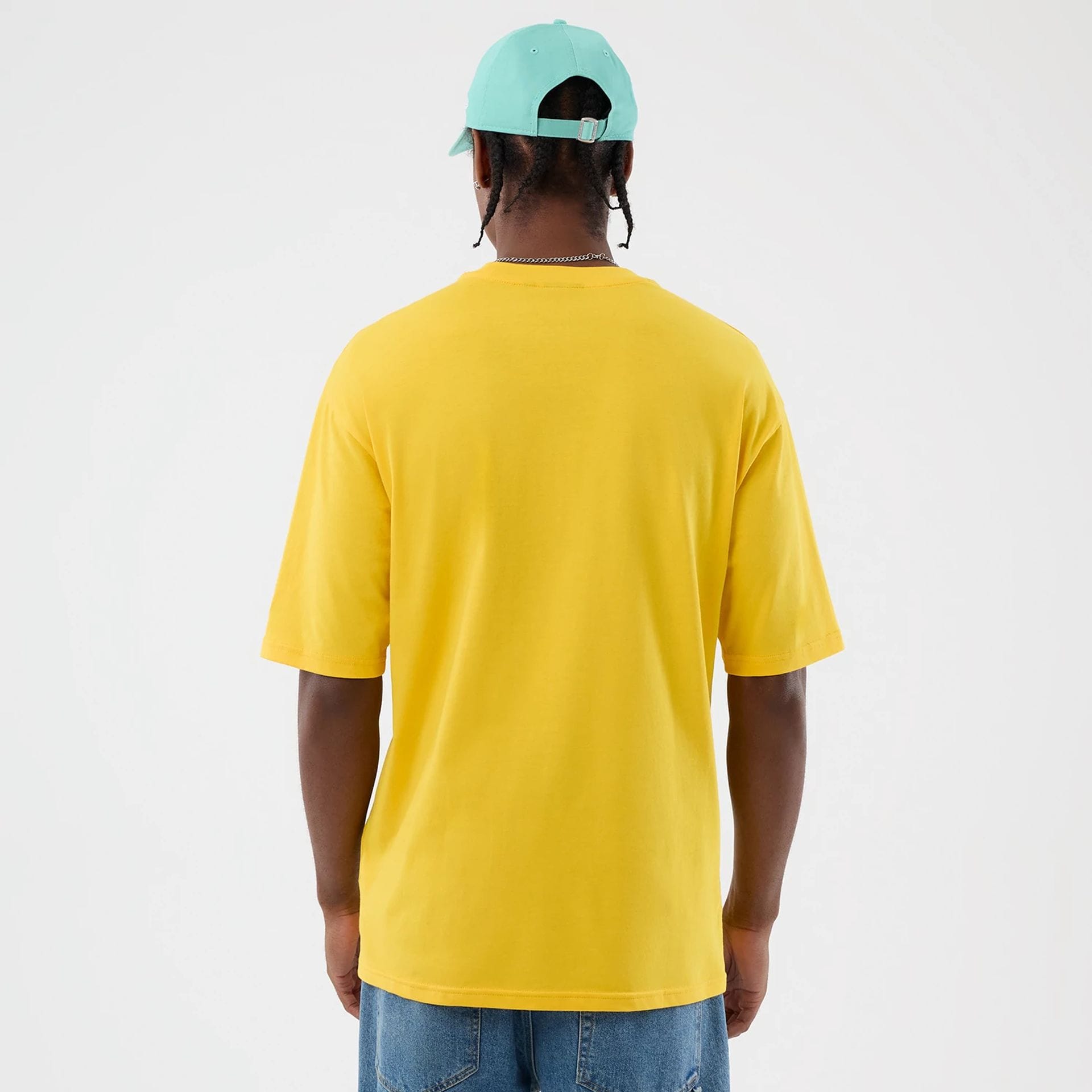 The model is wearing this New Era Alligator Character Graphic T-Shirt in yellow. 2