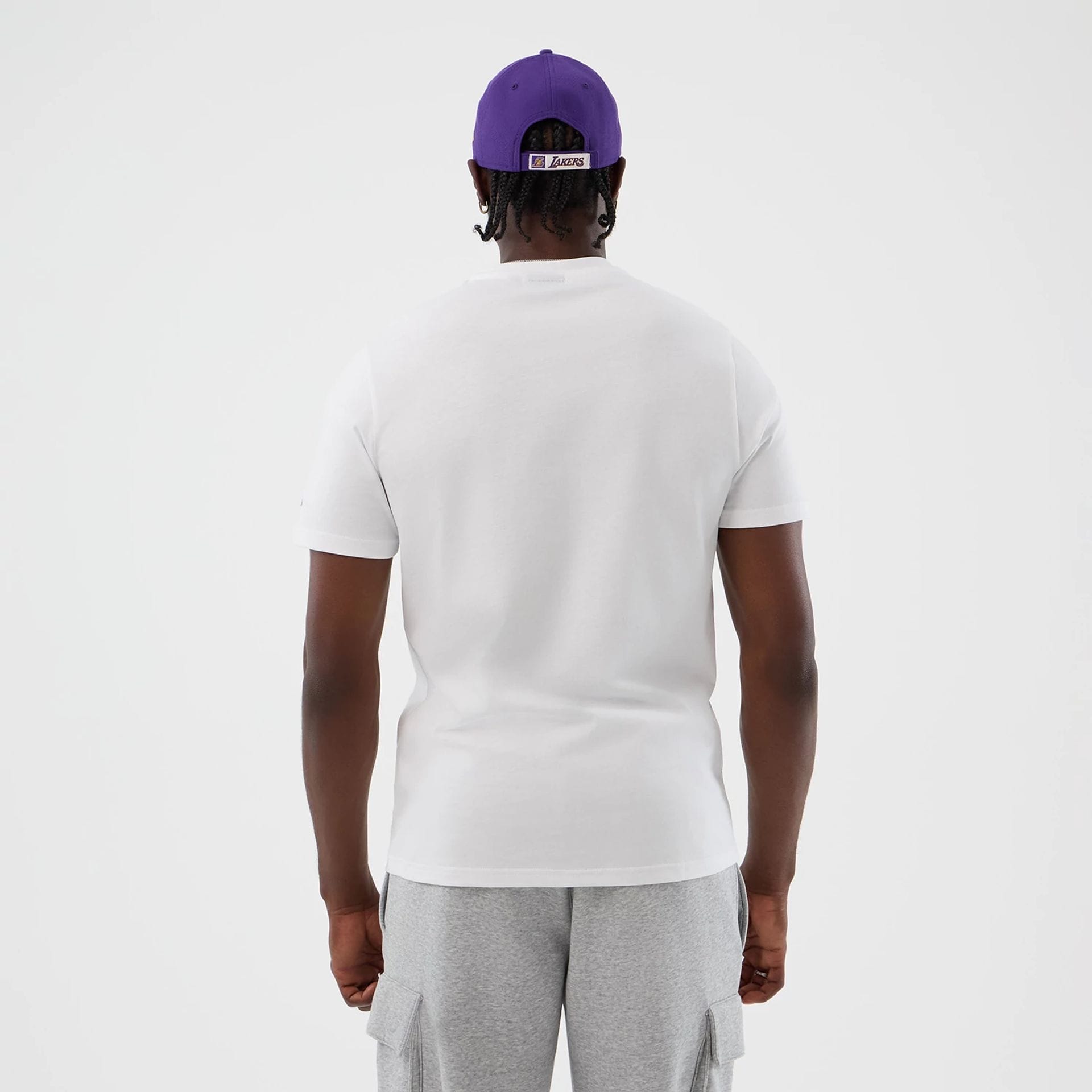The model is wearing this NBA Graphic LA Lakers T-Shirt in white. 2