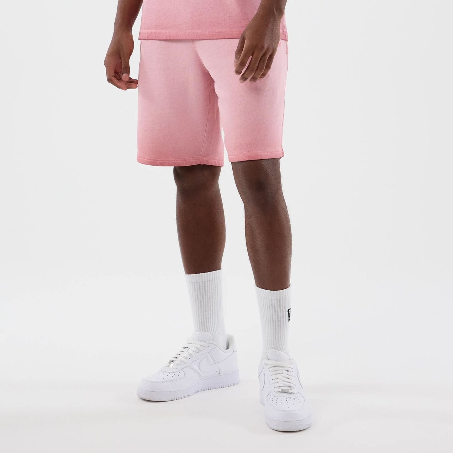 The model is wearing this MLB Washed Logo New York Yankees Shorts in pastel pink. 7