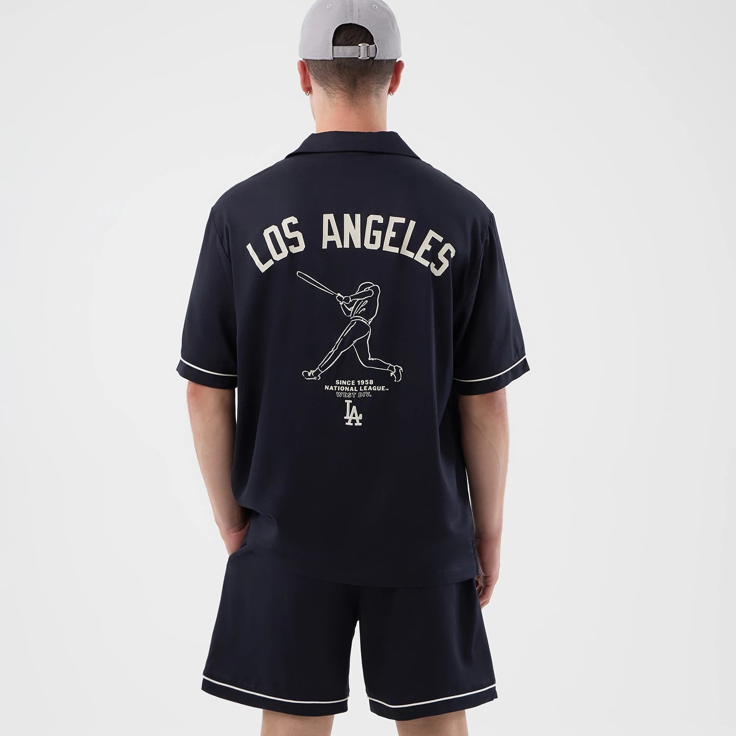 The model is wearing this MLB Graphic Revere LA Dodgers Short Sleeve Shirt in navy. 2
