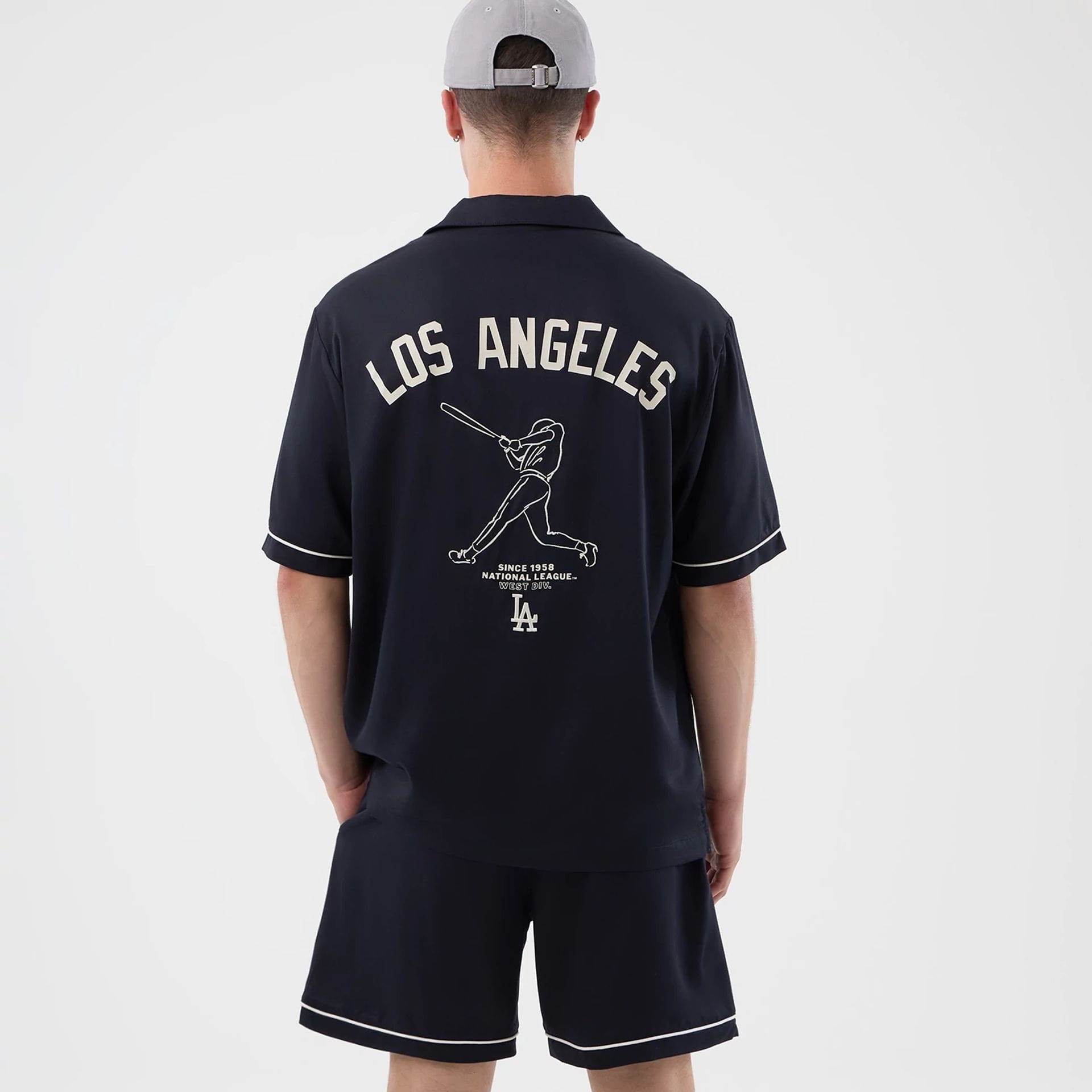 The model is wearing this MLB Graphic Revere LA Dodgers Short Sleeve Shirt in navy. 2