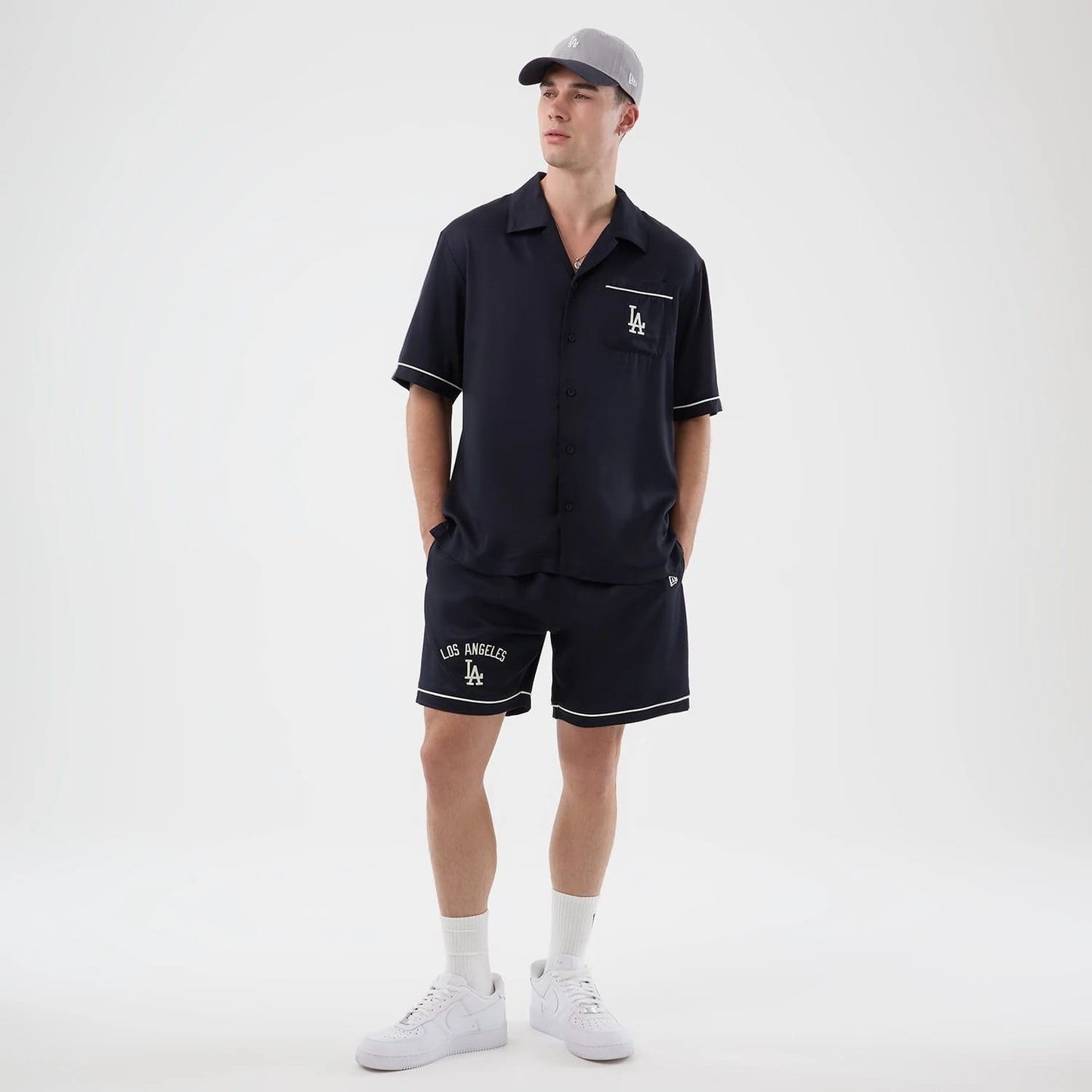 The model is wearing this MLB Graphic Revere LA Dodgers Short Sleeve Shirt in navy. 8