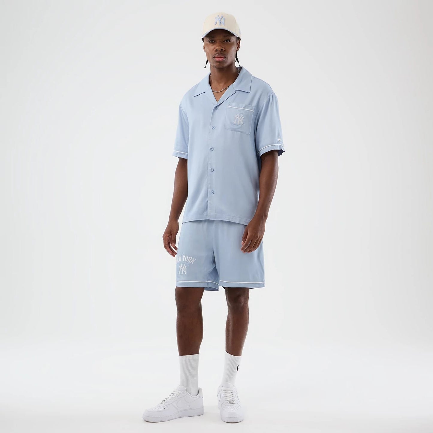 The model is wearing this MLB Woven New York Yankees Shorts in pastel blue. 8