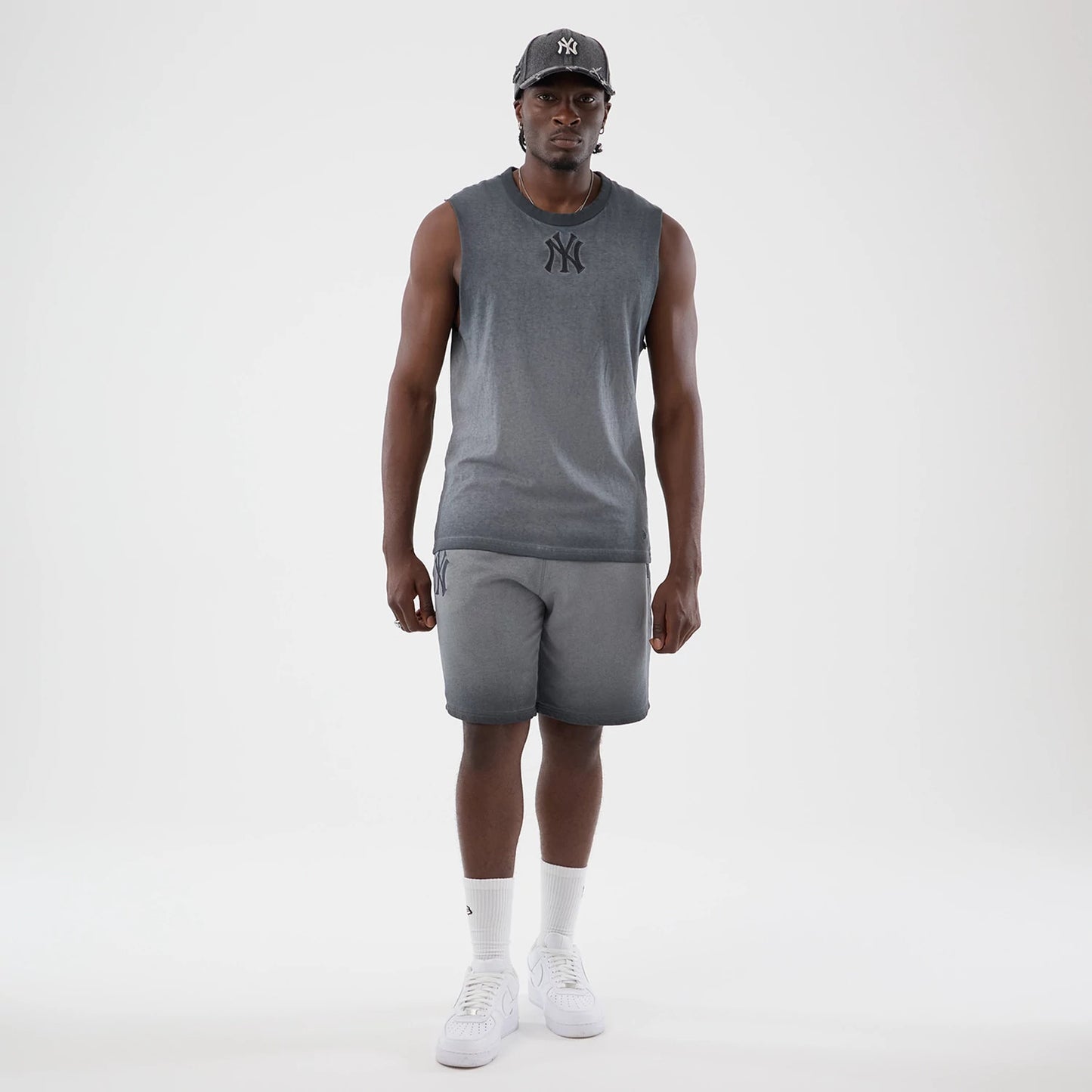 The model is wearing this MLB Washed Logo New York Yankees Vest in black. 8