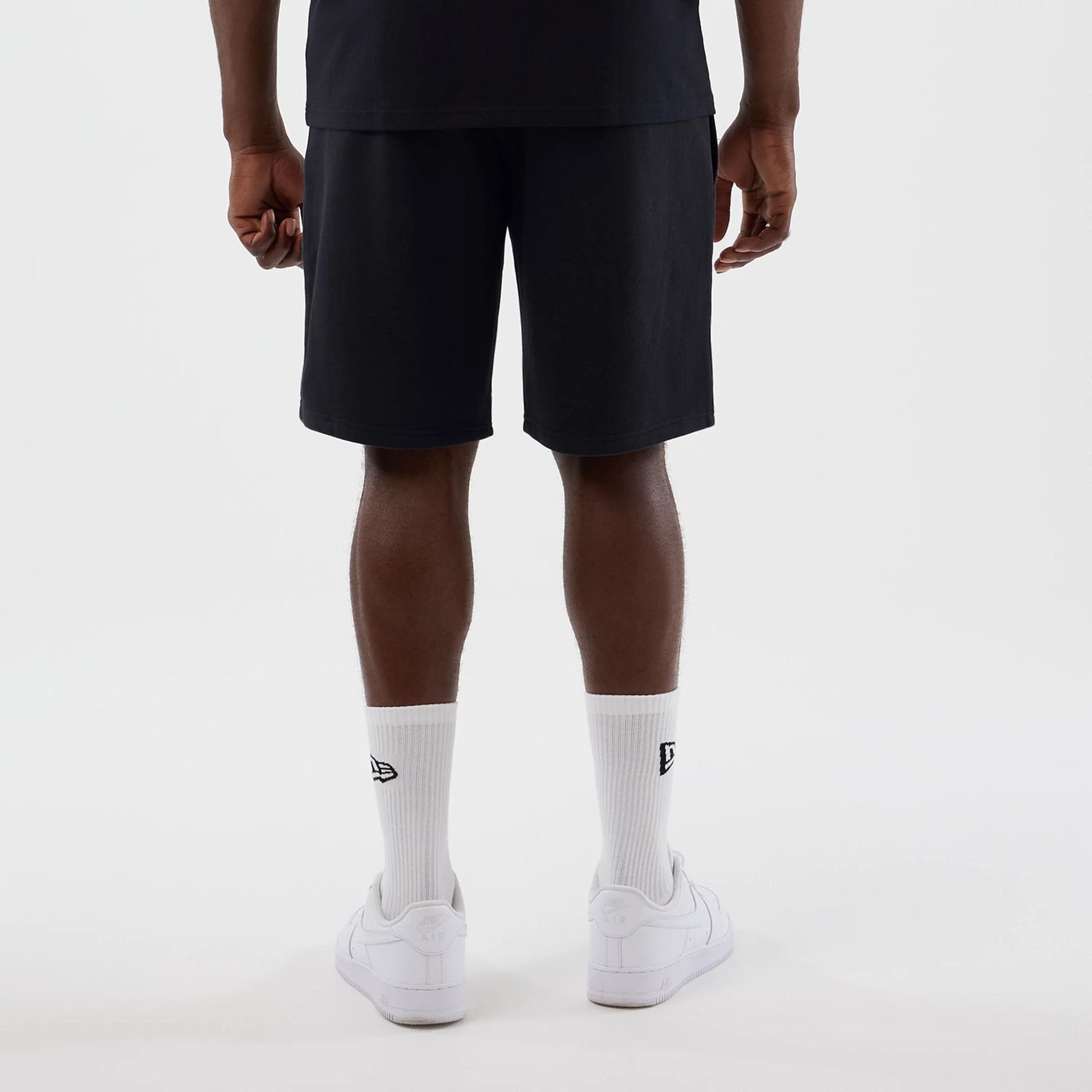 The model is wearing this NBA Core Plus LA Lakers Shorts in navy. 2