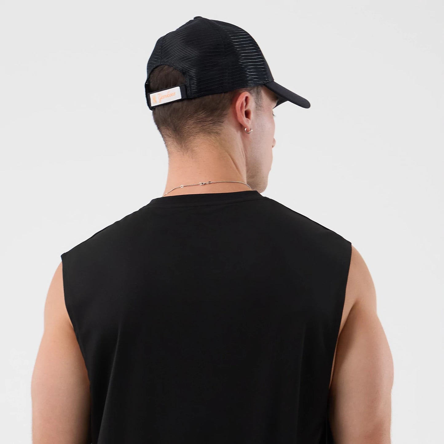 The model is wearing this MLB Core Plus New York Yankees Vest in black. 7