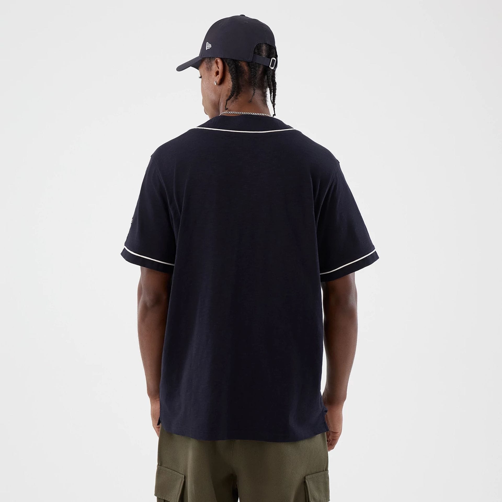 The model is wearing this New Era Slub Baseball Jersey in navy. 2