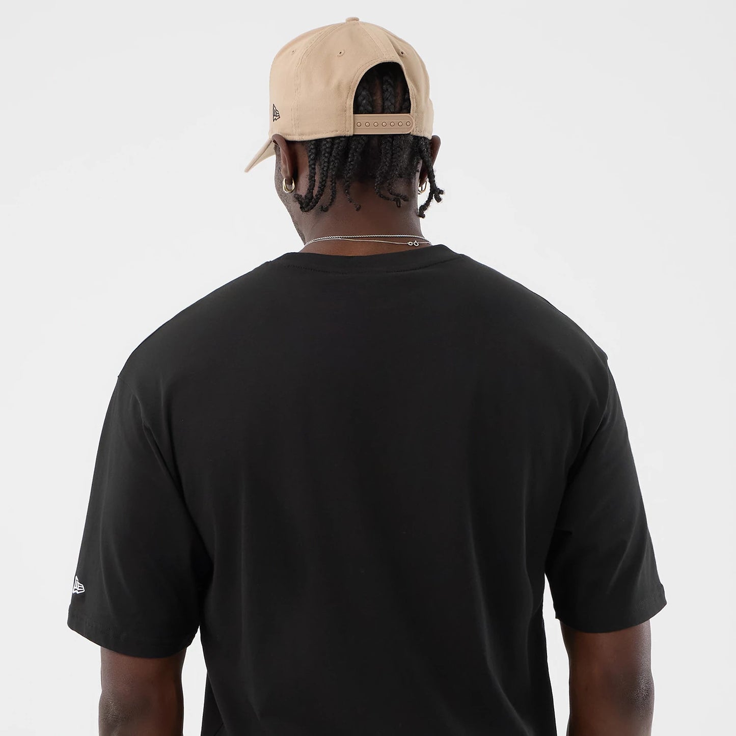 The model is wearing this New Era Serpent Graphic Oversized T-Shirt in black. 7