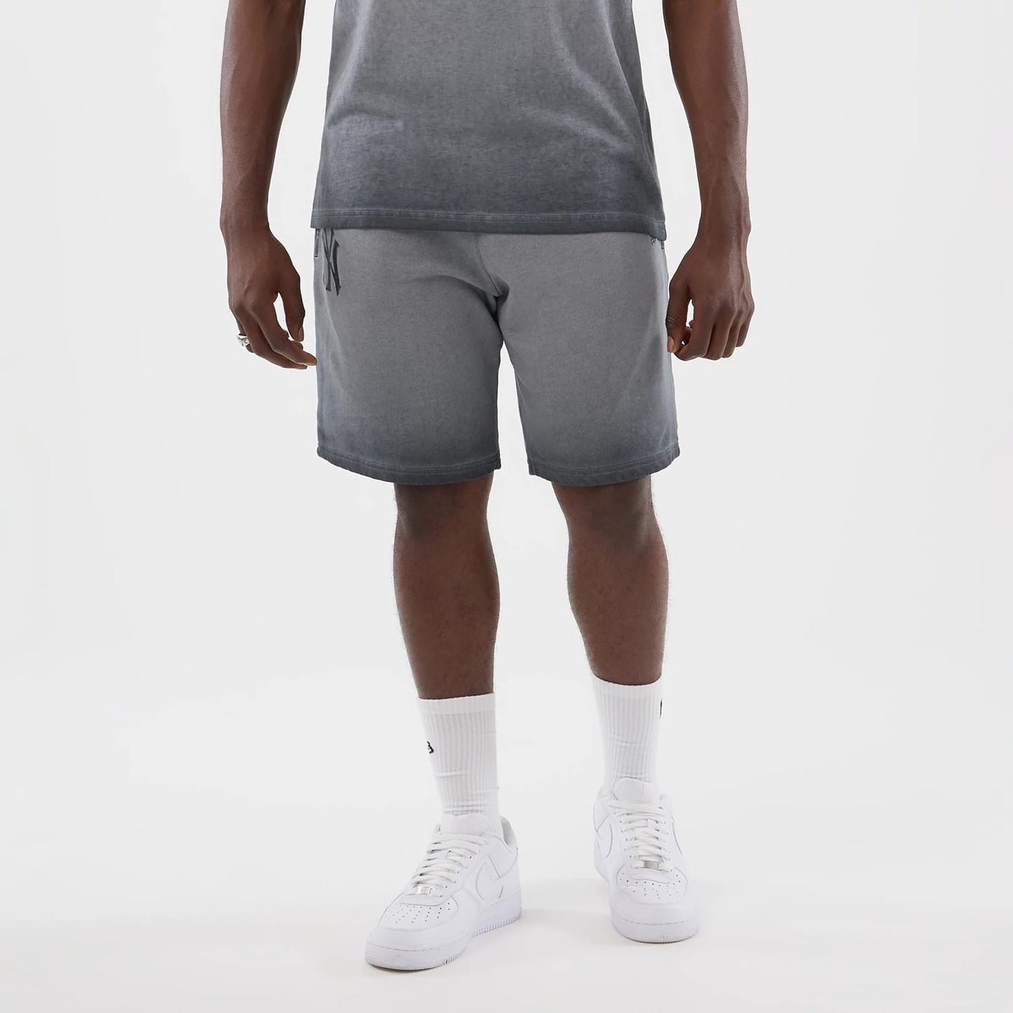The model is wearing this MLB Washed Logo New York Yankees Shorts in black. 7