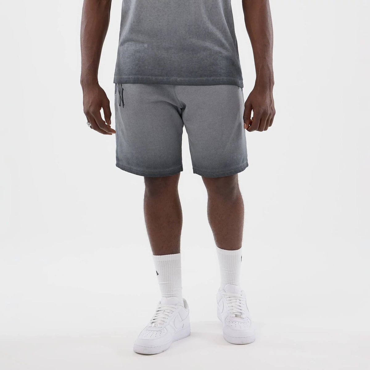 The model is wearing this MLB Washed Logo New York Yankees Shorts in black. 7
