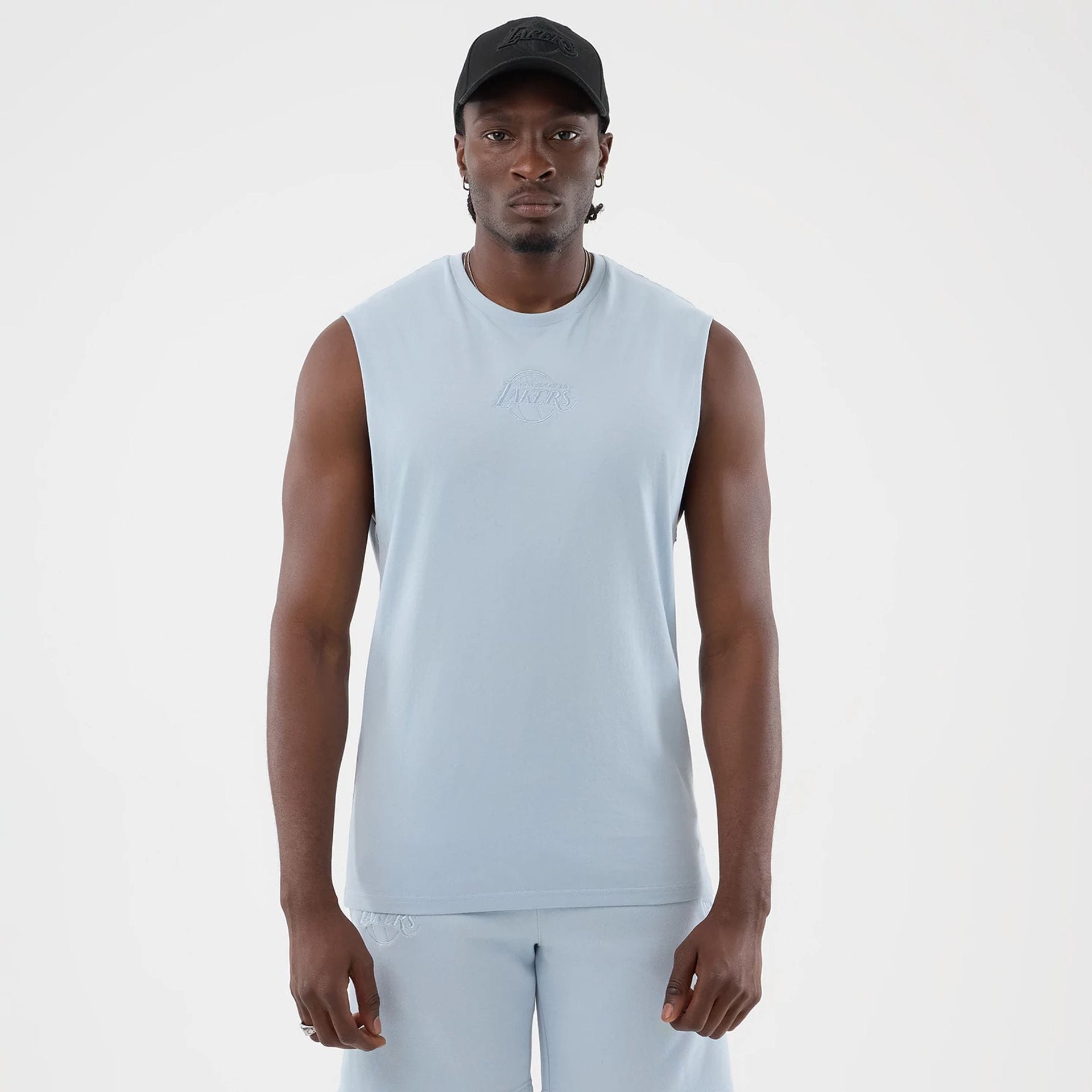 The model is wearing this NBA League Essential LA Lakers Vest in pastel blue. 1