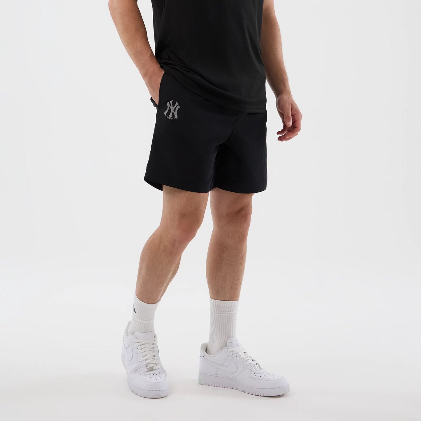 The model is wearing this MLB Core Plus New York Yankees Shorts in black. 7