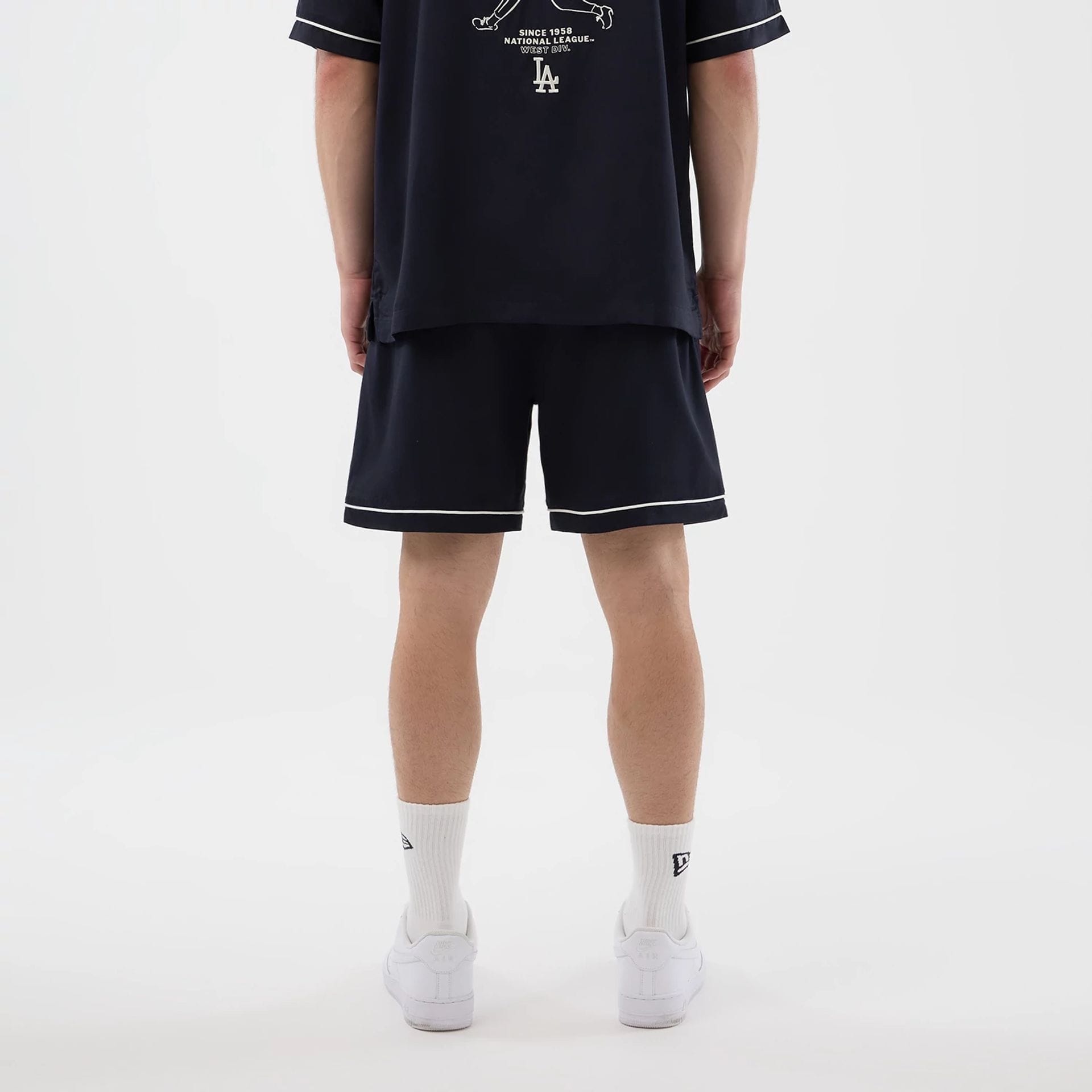 The model is wearing this MLB Woven LA Dodgers Shorts in navy. 2