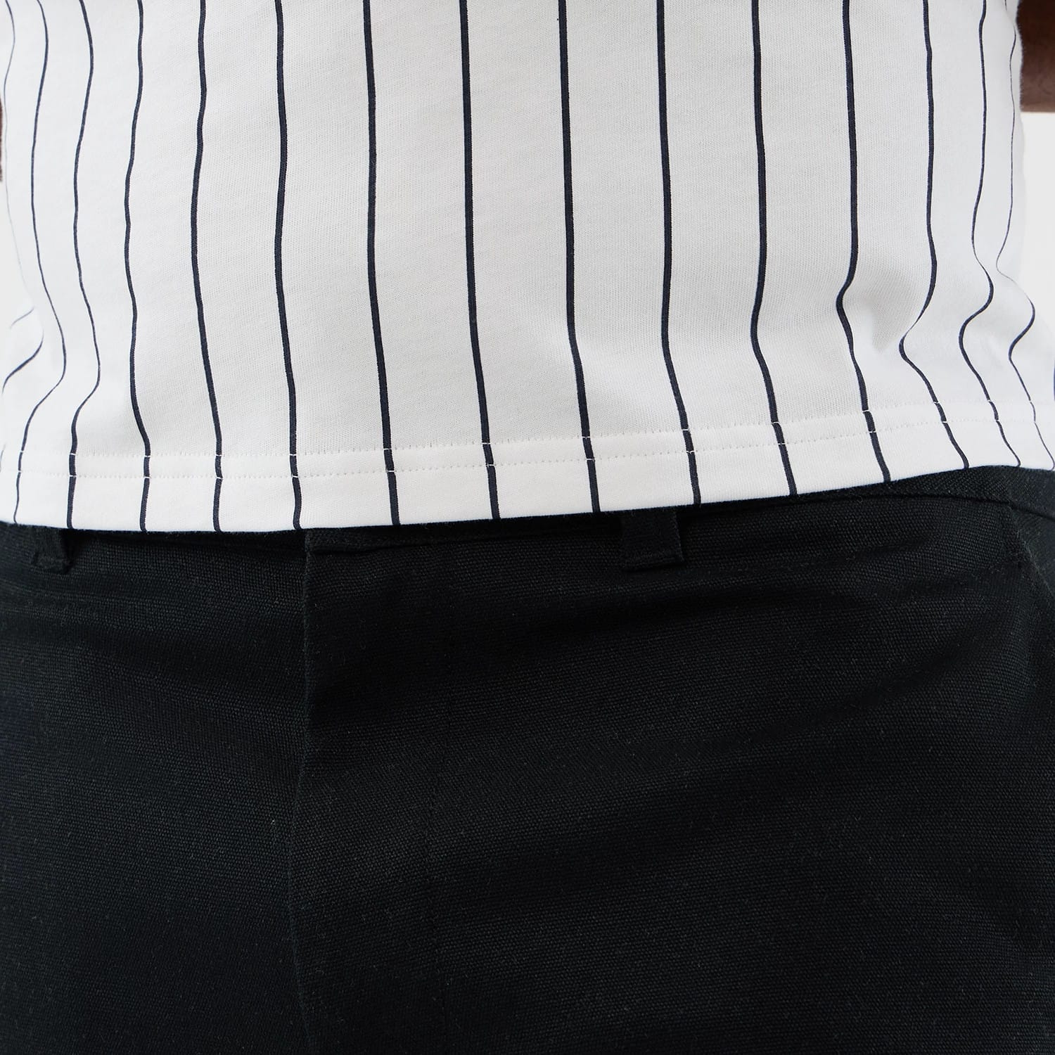 The model is wearing this New Era Cargo Shorts in black. 4