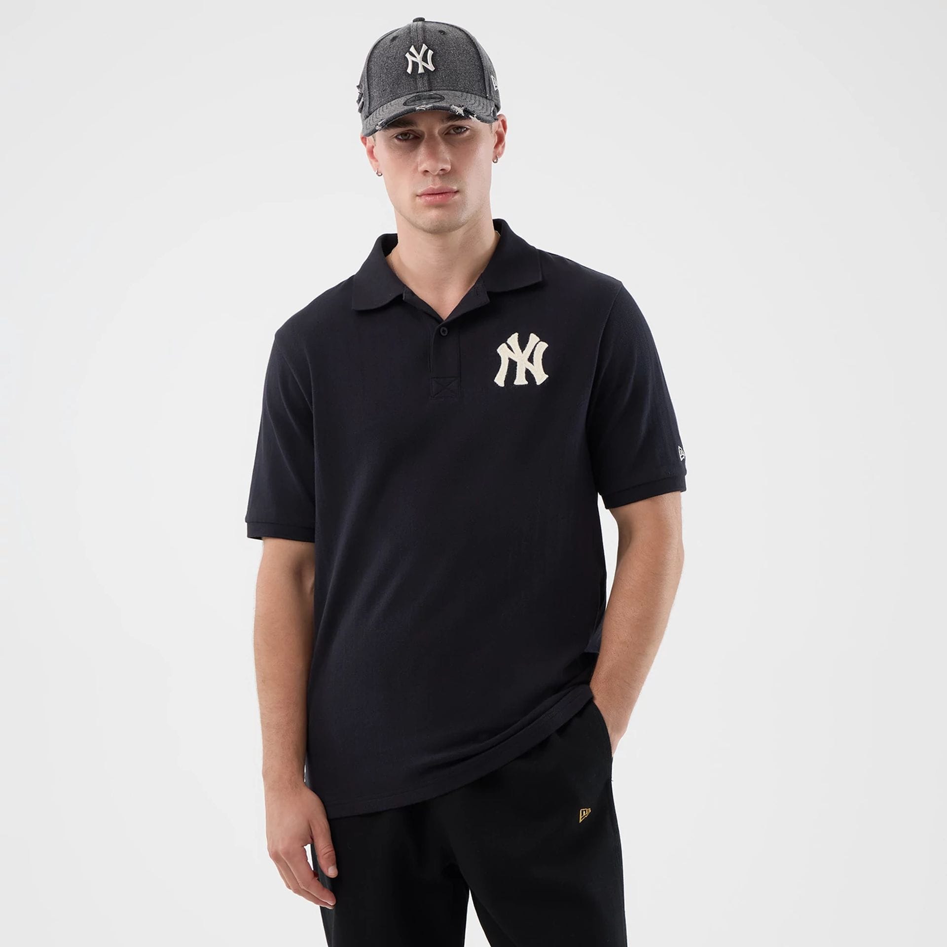 The model is wearing this MLB Rib New York Yankees Polo T-Shirt in navy. 1