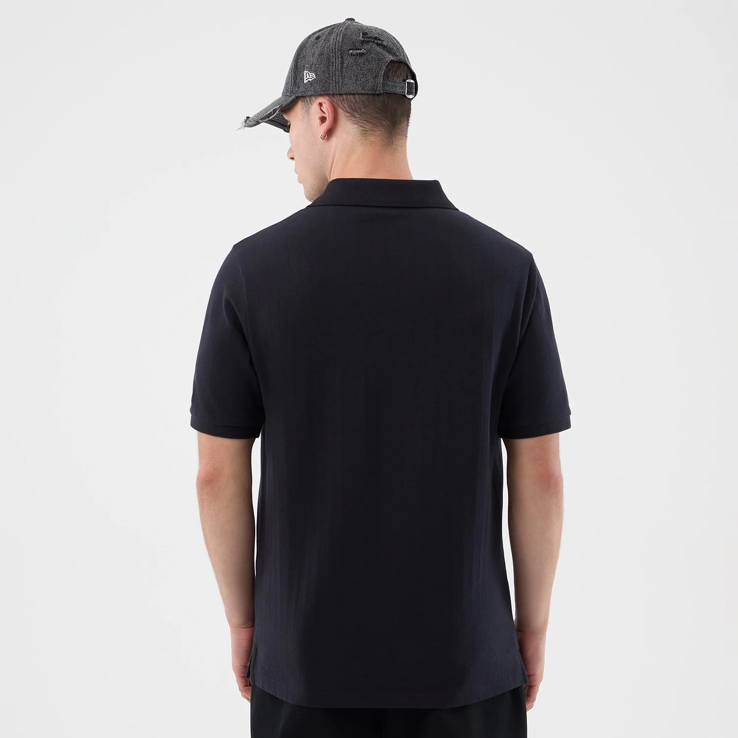 The model is wearing this MLB Rib New York Yankees Polo T-Shirt in navy. 2