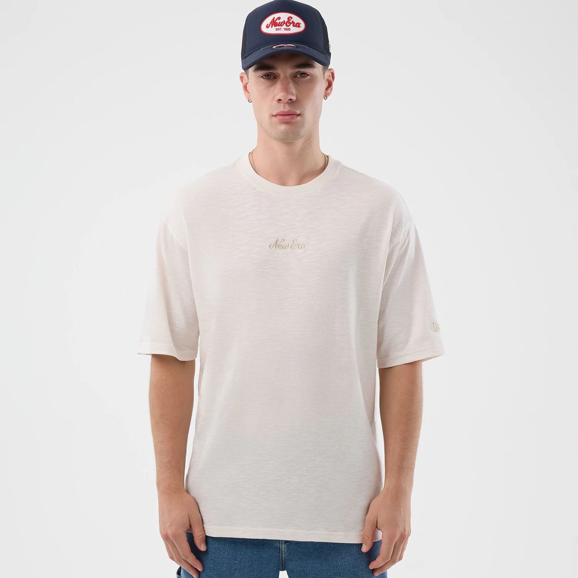 The model is wearing this New Era Slub Oversized T-Shirt in open white. 1