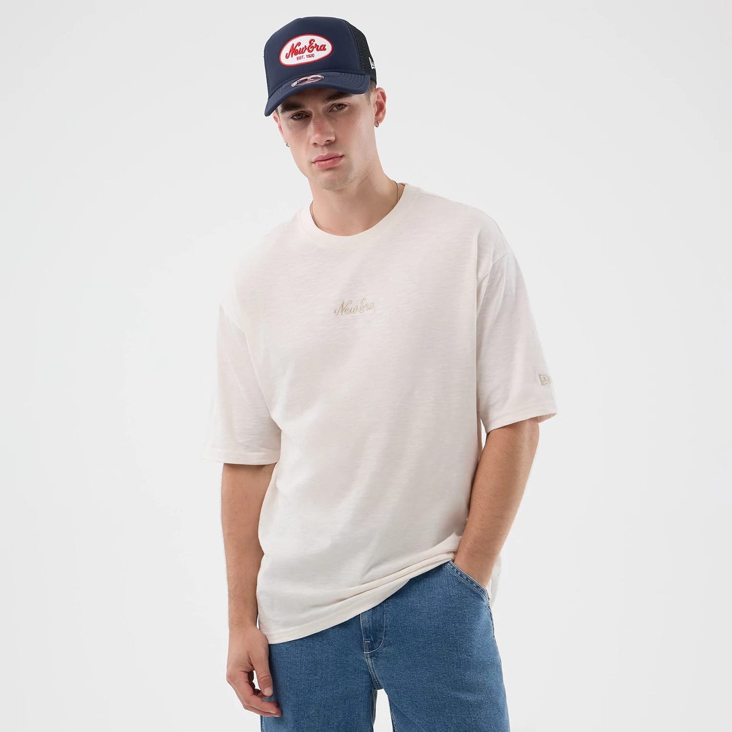 The model is wearing this New Era Slub Oversized T-Shirt in open white. 7