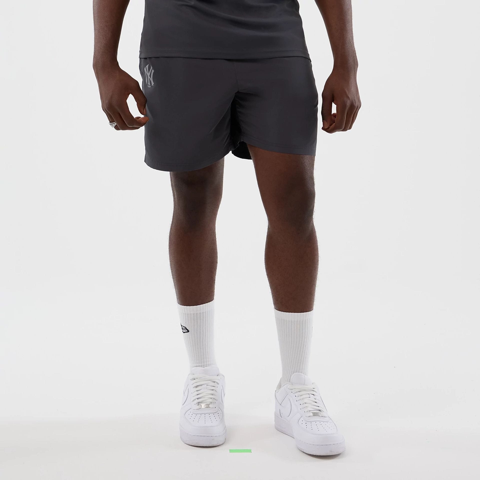 The model is wearing this MLB Core Plus New York Yankees Shorts in dark grey. 1