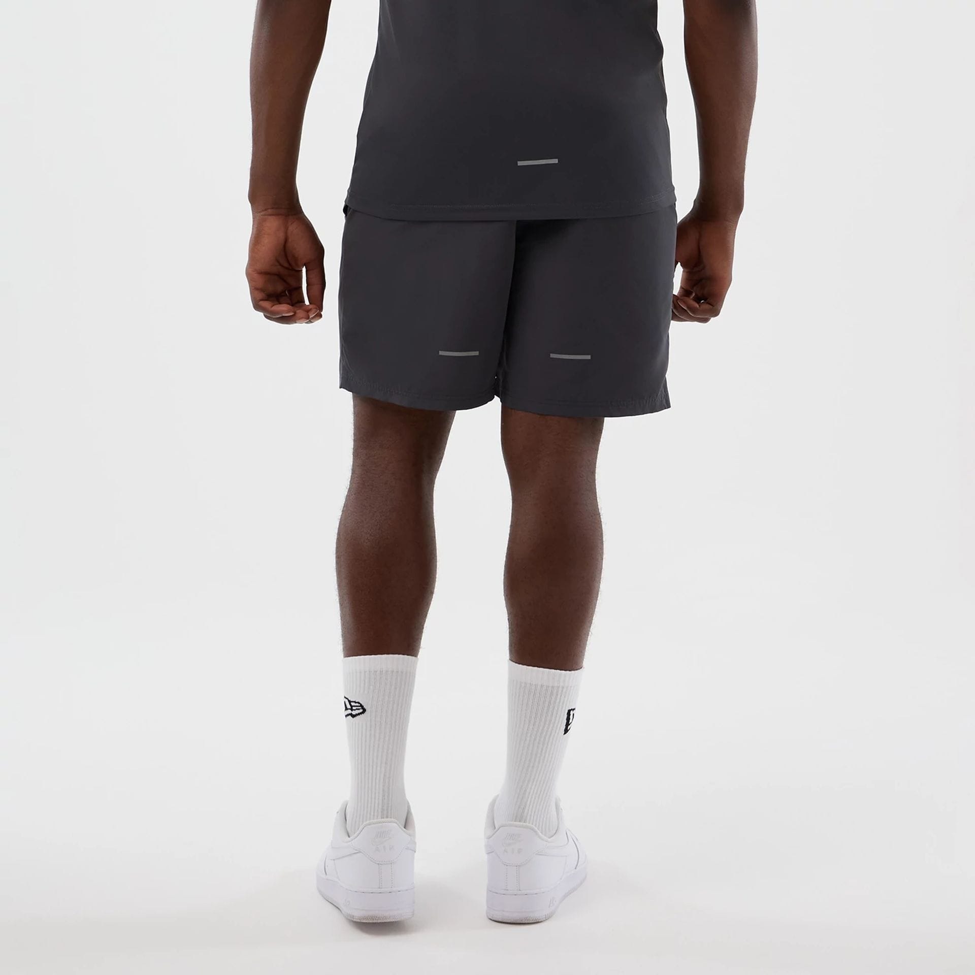 The model is wearing this MLB Core Plus New York Yankees Shorts in dark grey. 2