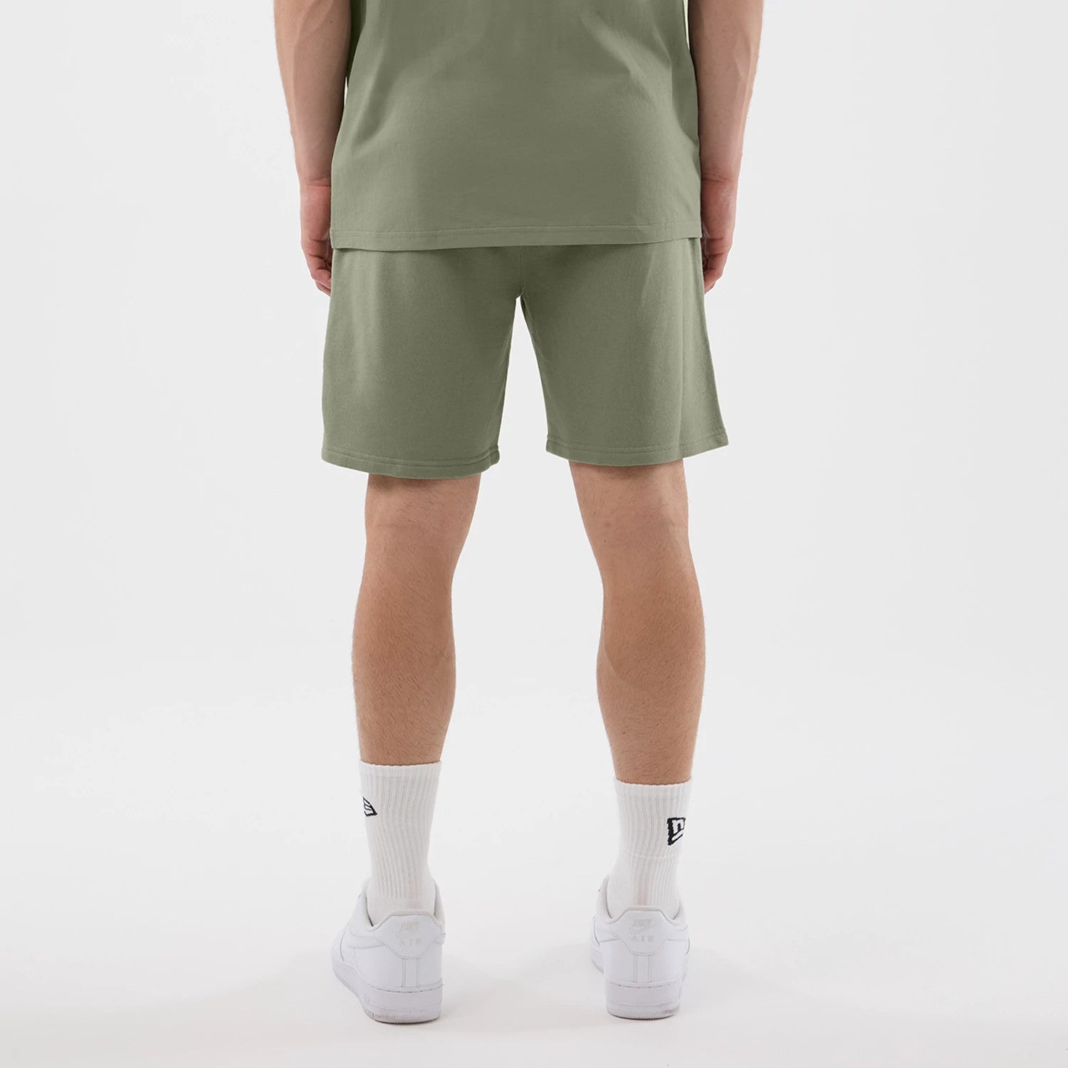 The model is wearing this NBA League Essential Chicago Bulls Shorts in pastel green. 2