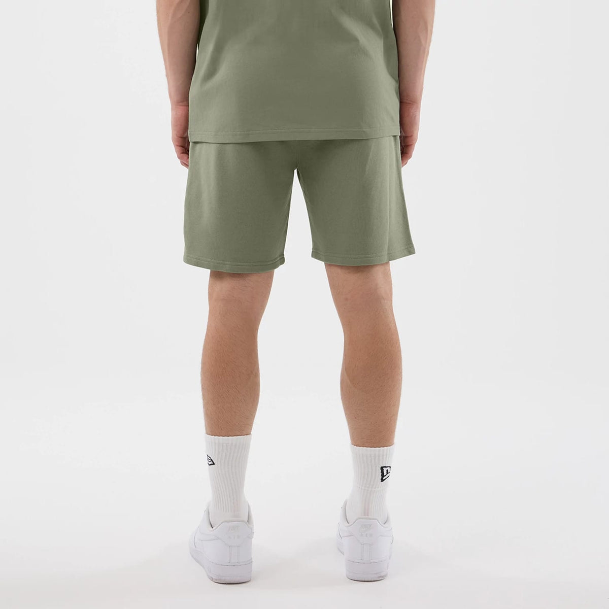 The model is wearing this NBA League Essential Chicago Bulls Shorts in pastel green. 2