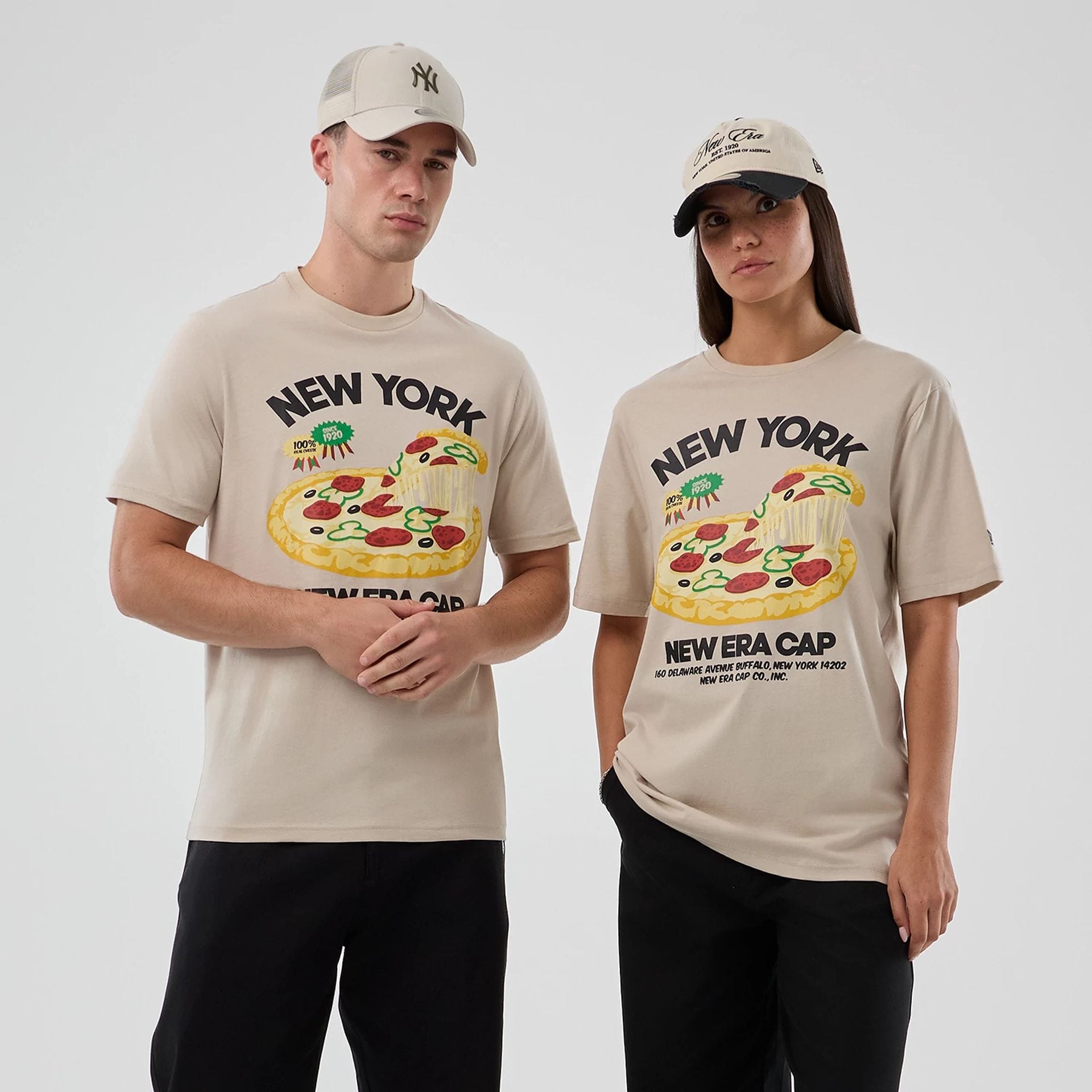 The model is wearing this New Era Pizza Graphic T-Shirt in light beige. 1