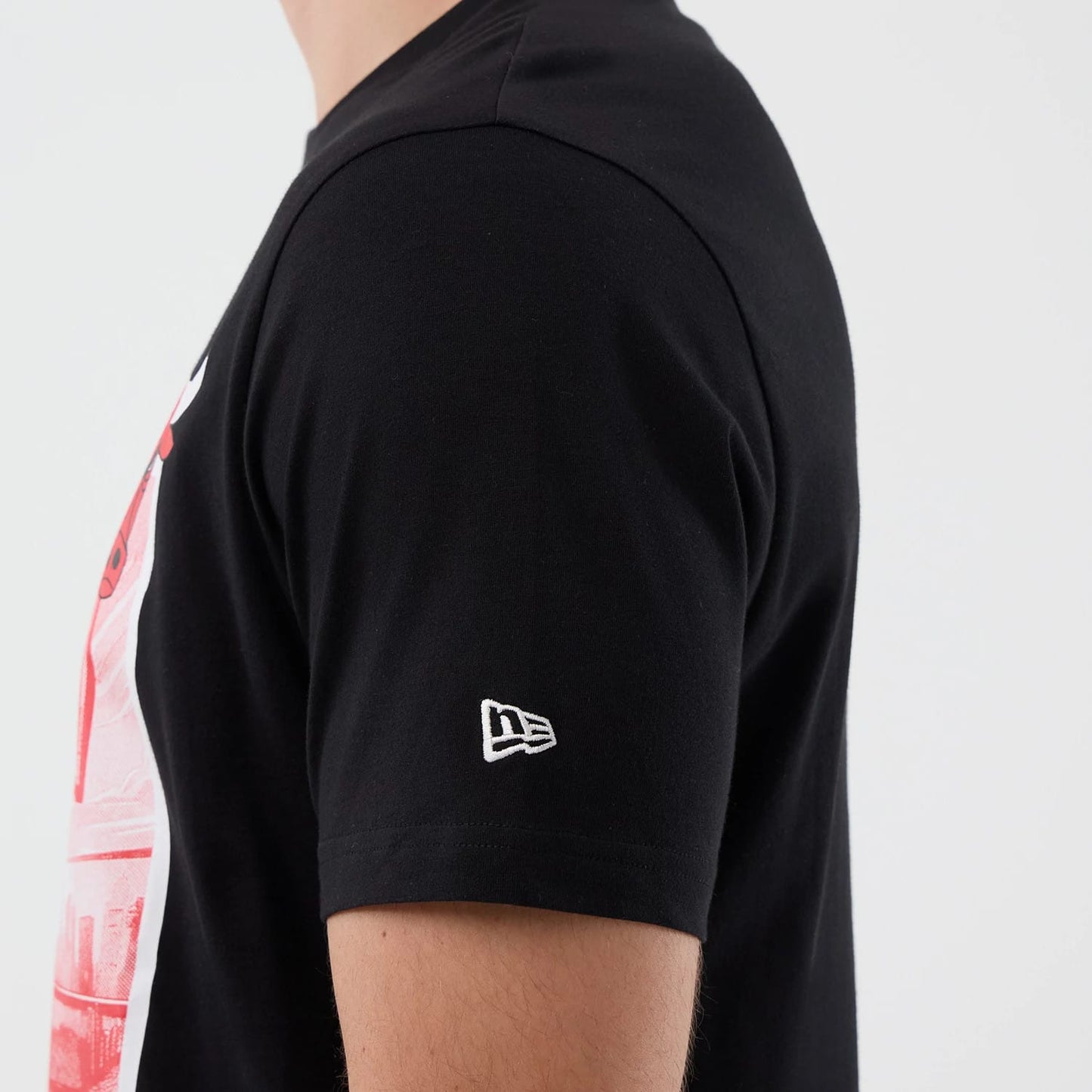 The model is wearing this NBA Court Graphic Chicago Bulls T-Shirt in black. 7