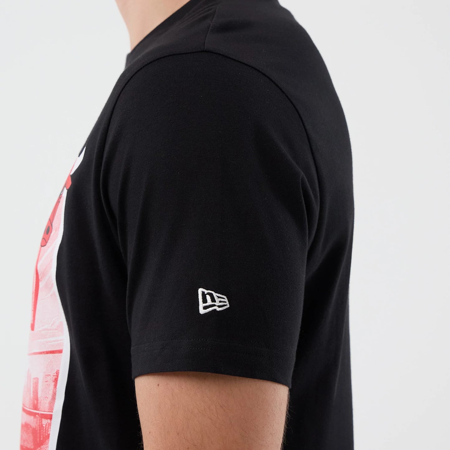 The model is wearing this NBA Court Graphic Chicago Bulls T-Shirt in black. 7