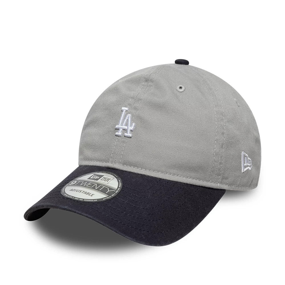 LA Dodgers MLB Washed Contrast Grey New Era 9TWENTY Adjustable Cap, three-quarter view showing the white embroidered LA logo on the front panel, a contrasting black curved visor with a 9TWENTY size sticker, and the New Era flag logo on the left side.