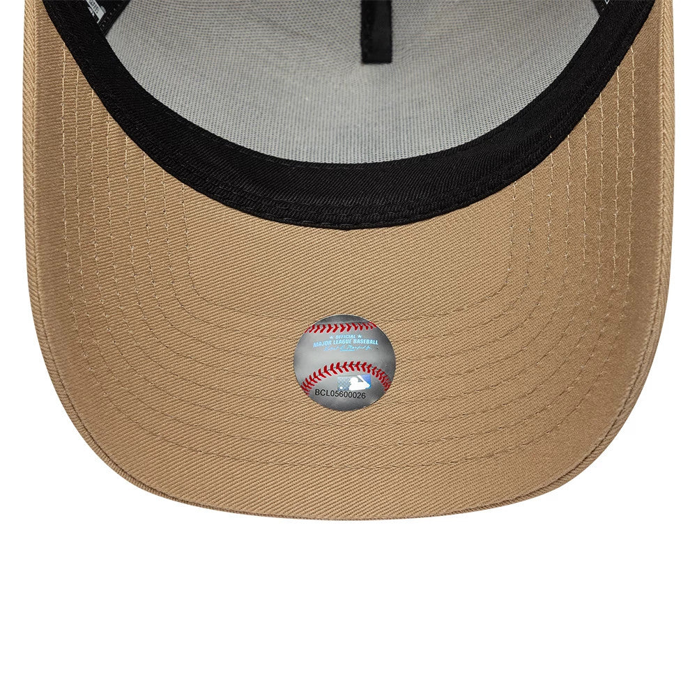 LA Dodgers MLB League Essential Light Beige New Era 9FORTY E-Frame Adjustable Cap, inside view showing the black lined sweatband, grey undervisor with a structured panel design, and a baseball-themed sticker on the light beige bottom visor.