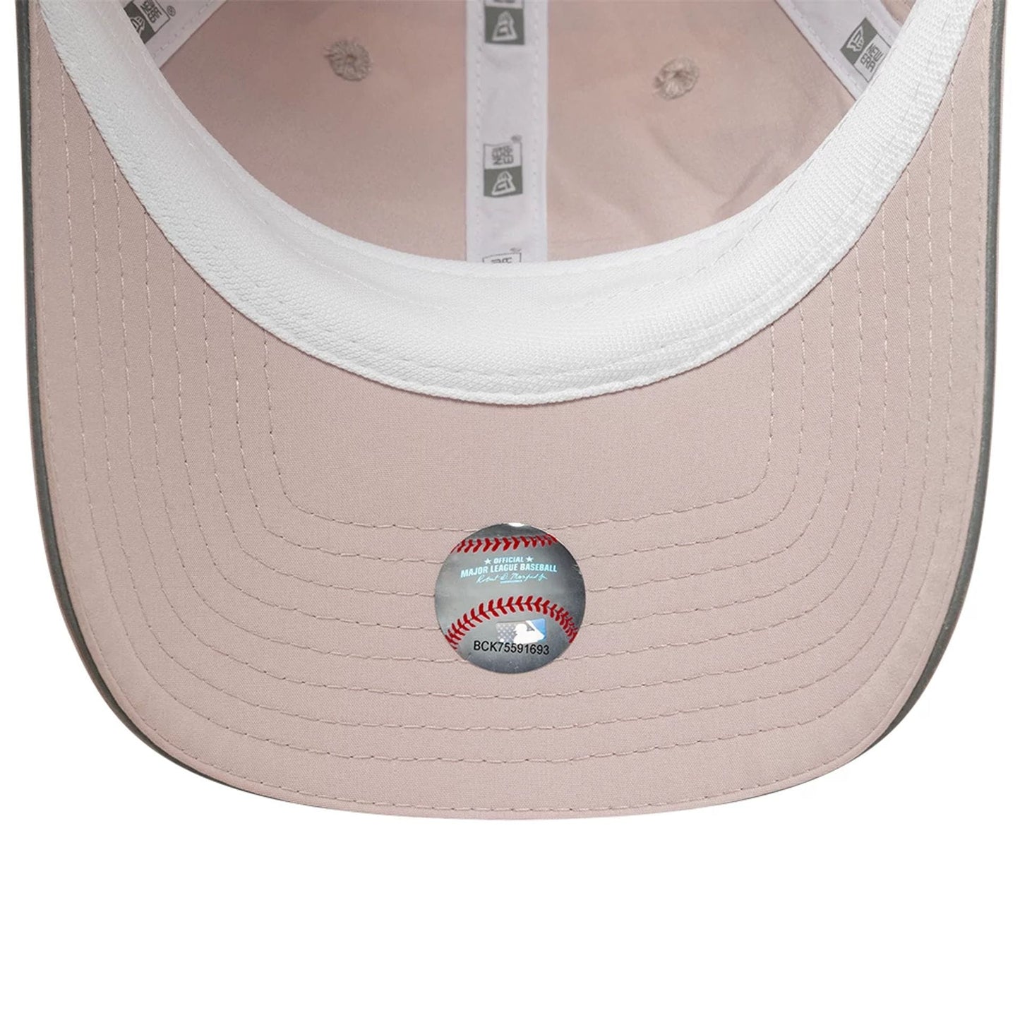 New Era New York Yankees Womens MLB Mesh Pastel Pink Pony Tail Cap, inside view showing grey undervisor with detailed stitching, white sweatband for comfort, and official MLB authentication sticker placed centrally.