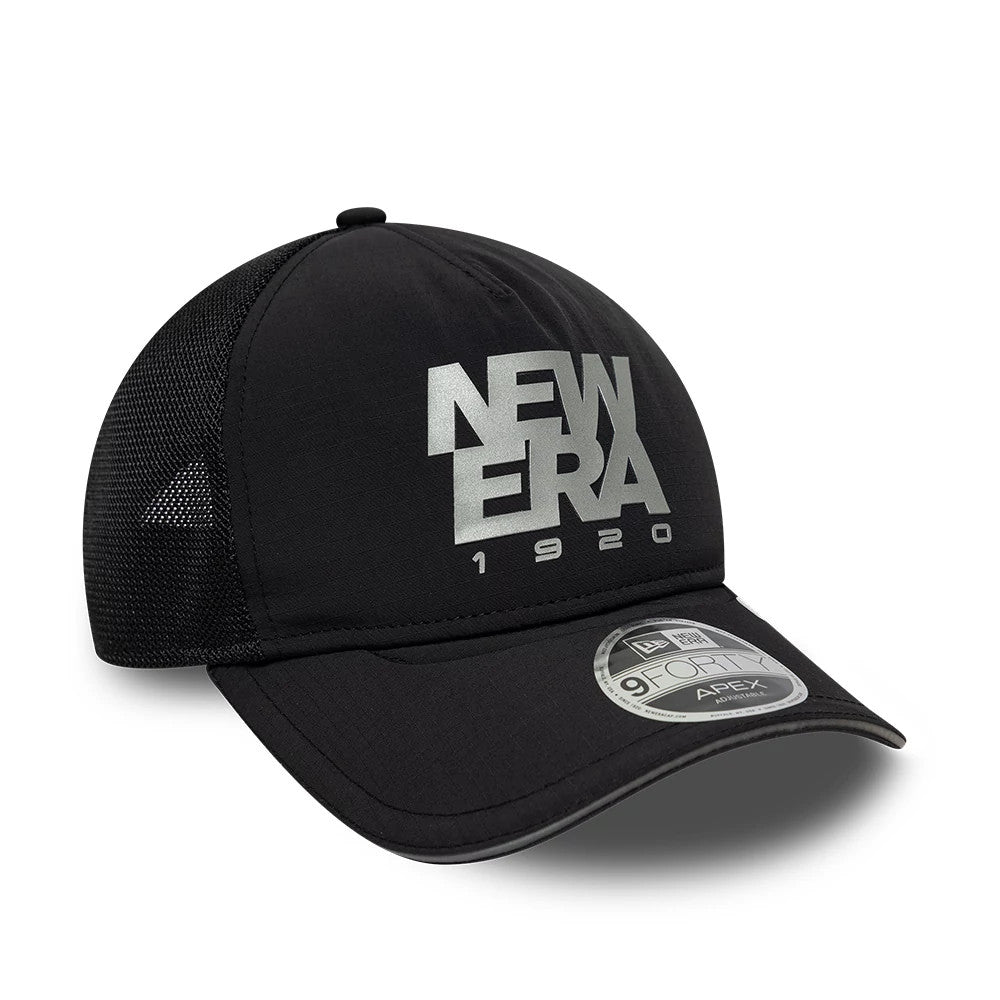 New Era Performance Black 9FORTY M-Crown A-Frame Trucker Adjustable Cap, three-quarter view showing a raised silver New Era 1920 front logo, complemented by a curved black visor with a 9FORTY size sticker.