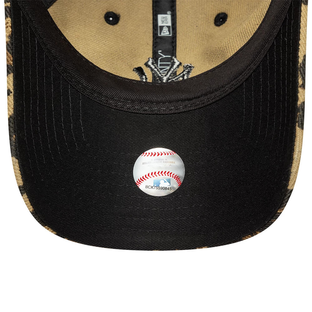 New York Yankees Womens MLB Leopard Dark Brown New Era 9TWENTY Adjustable Cap, inside view showing the beige interior with black taping, a black sweatband, and a black undervisor featuring an official MLB sticker at the centre.