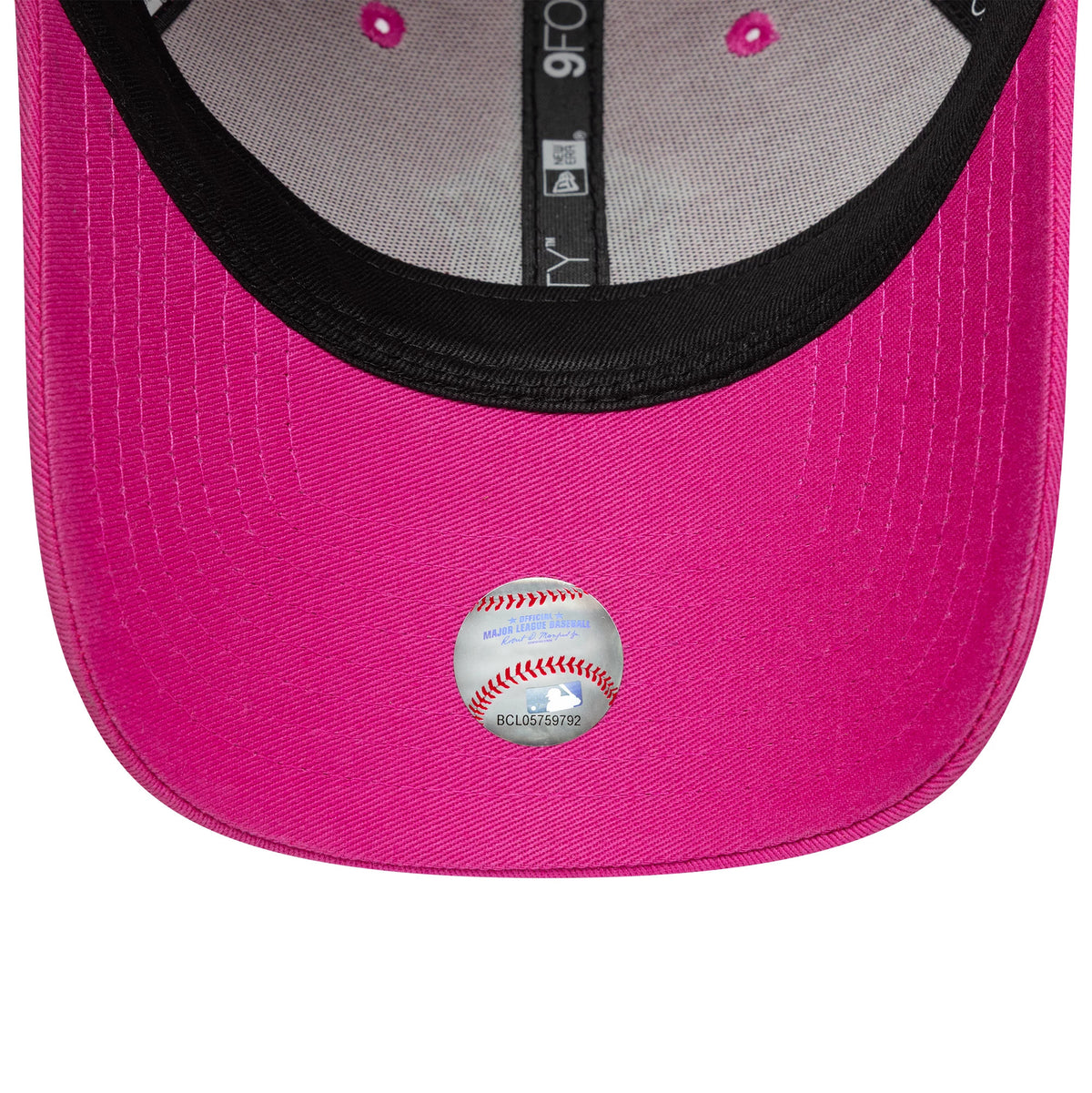New York Yankees MLB Team Outline Bright Pink New Era 9FORTY Adjustable Cap, inside view showing the pink undervisor with a 9FORTY size sticker, black sweatband, and black and white labelled taping across the crown.