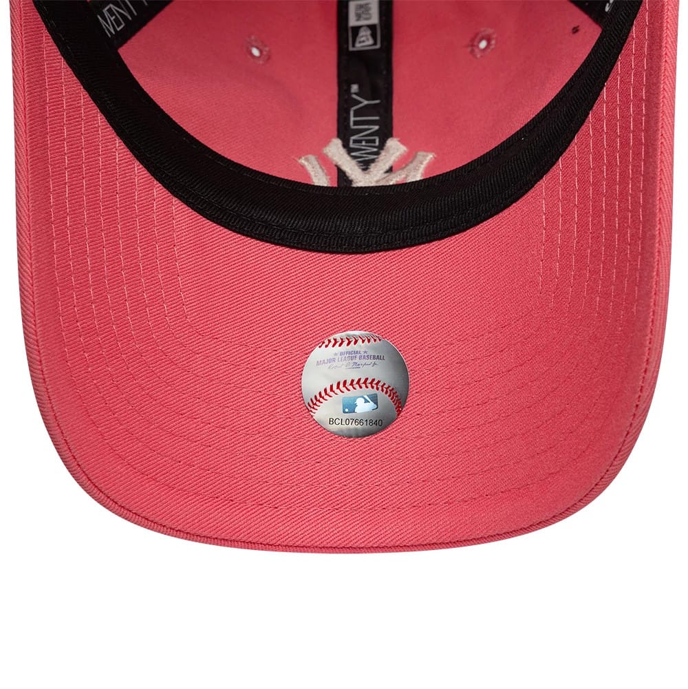 New York Yankees Womens MLB League Essential Pink New Era 9TWENTY Adjustable Cap, inside view showing the black sweatband, pink undervisor with an official MLB sticker, and printed taping.