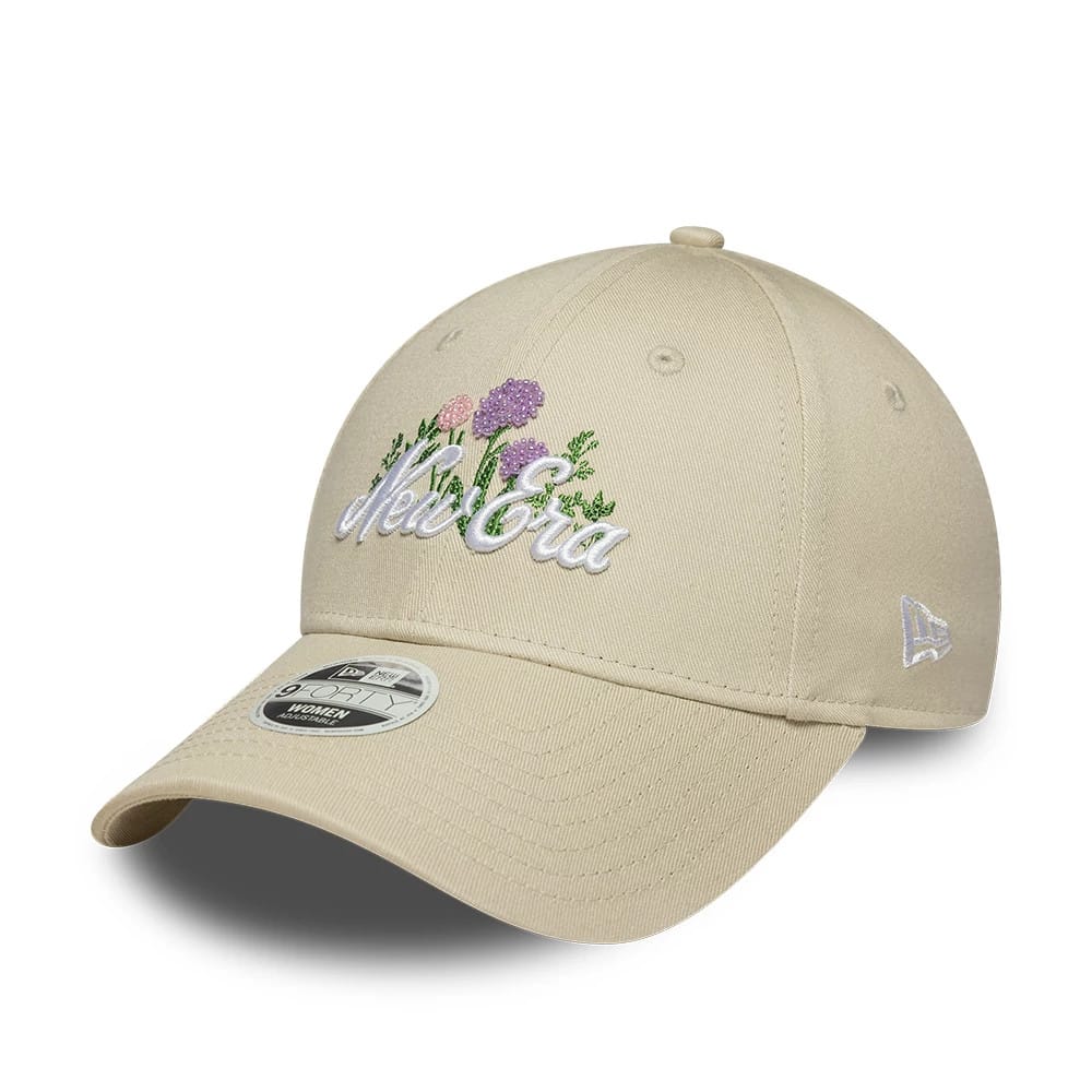 Womens New Era Beaded Light Beige 9FORTY Adjustable Cap, three-quarter view showing the white embroidered New Era script and purple beaded flowers on the front panel, light beige curved visor with a 9FORTY size sticker.